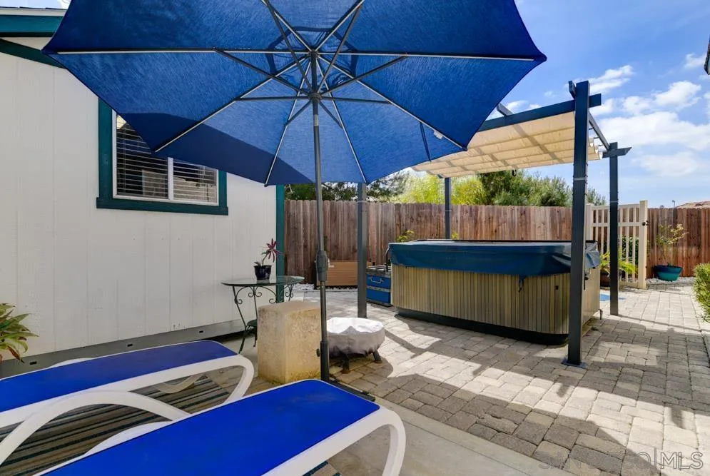 963 Martinique Drive Chula Vista, CA 91913 - Photo 35 of 37 a backyard of a house with wooden floor and outdoor seating