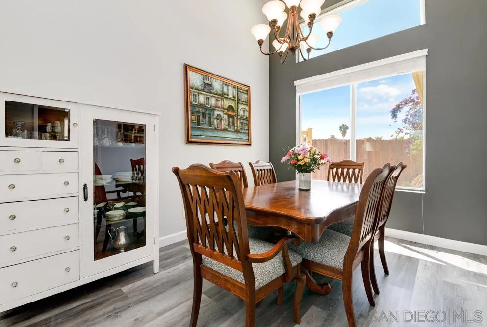 963 Martinique Drive Chula Vista, CA 91913 - Photo 10 of 37 a view of a dining room with furniture and wooden floor
