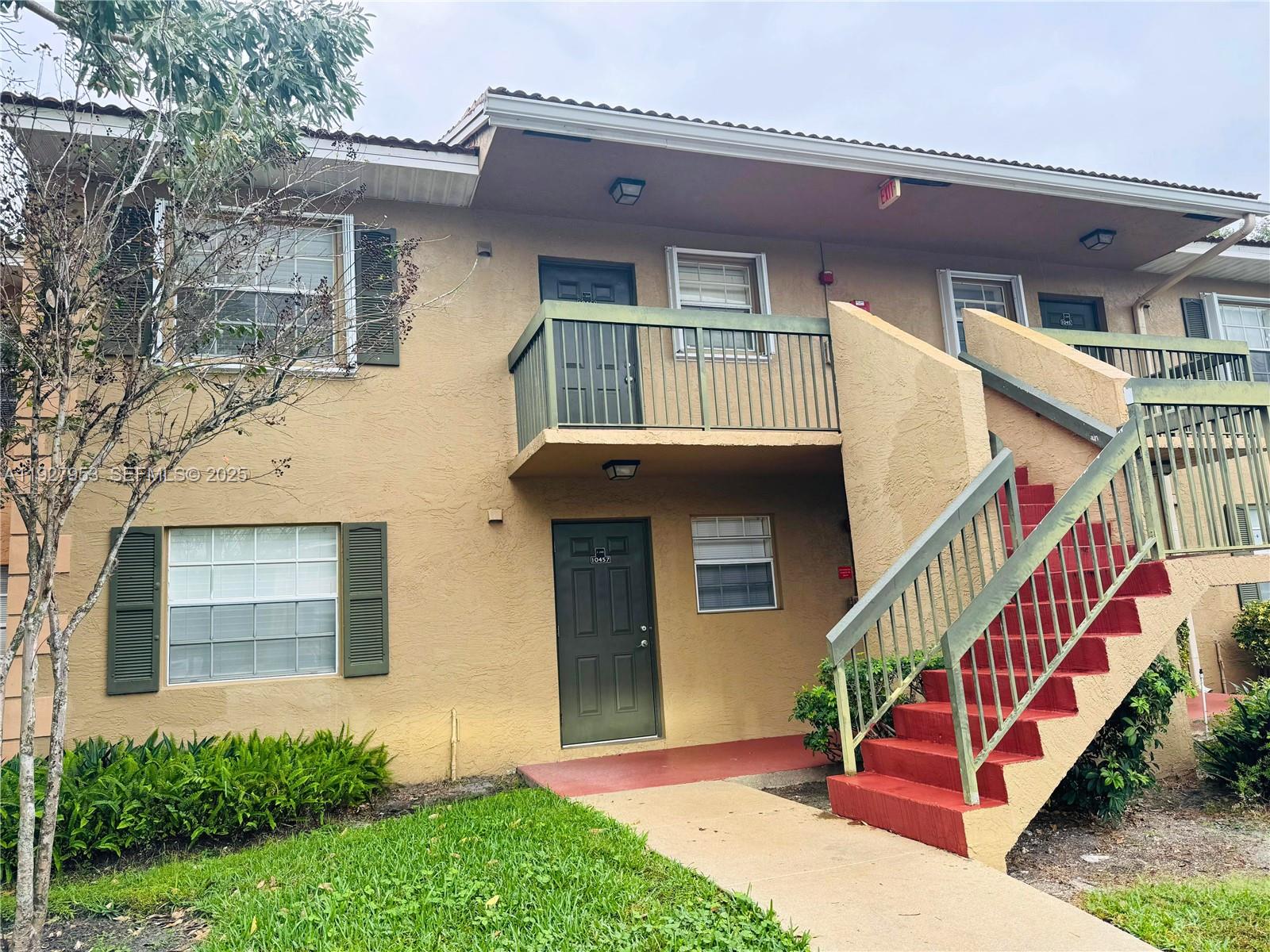 a front view of a house with staircase