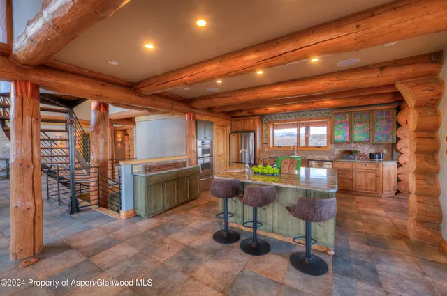 a view of a dining room with furniture and window