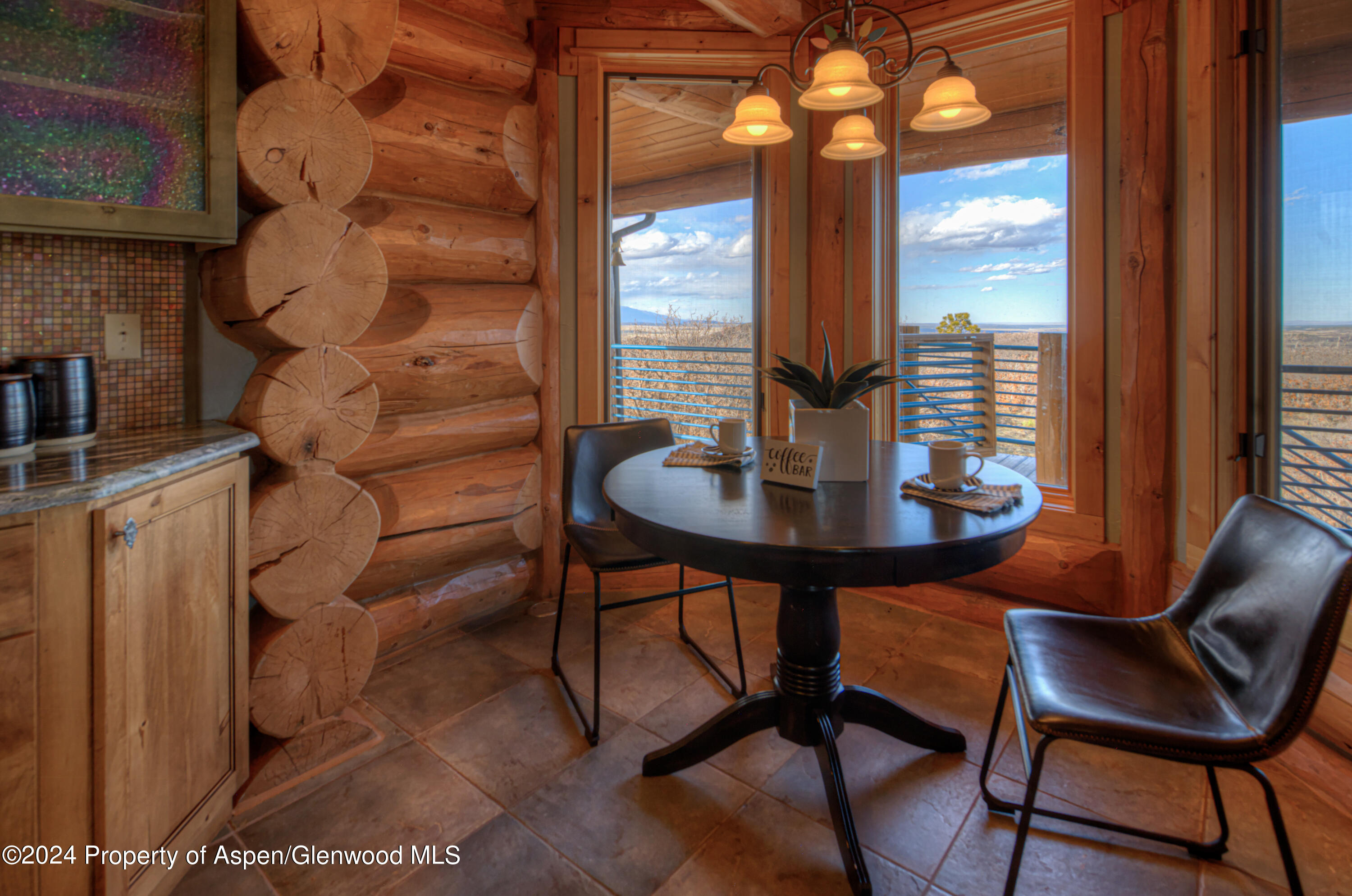 1390 Mountain Valley Road La Veta, CO 81055 - Photo 14 of 43 a view of a dining room with furniture and window