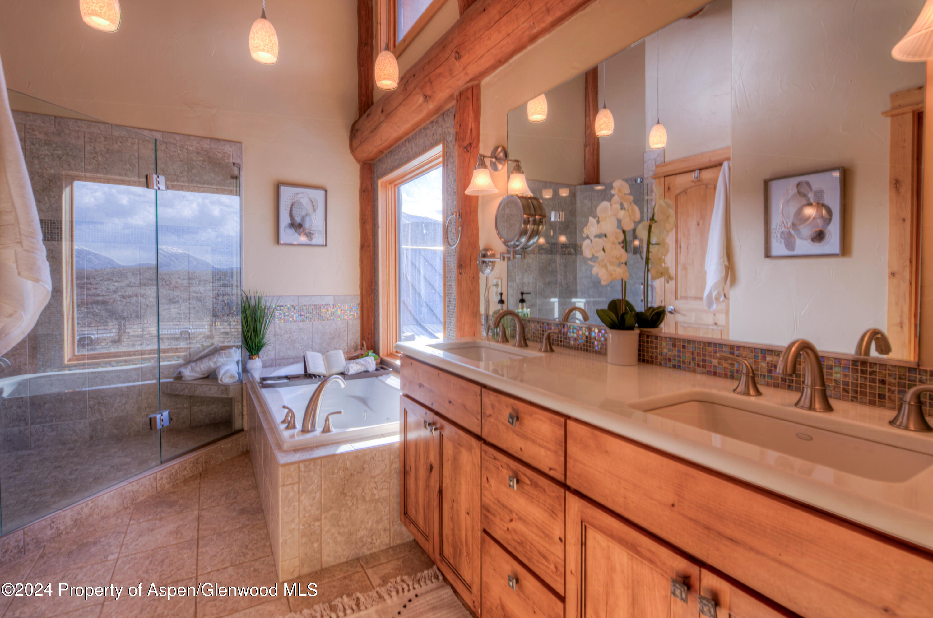 1390 Mountain Valley Road La Veta, CO 81055 - Photo 22 of 43 a spacious bathroom with sinks mirror and a bathtub