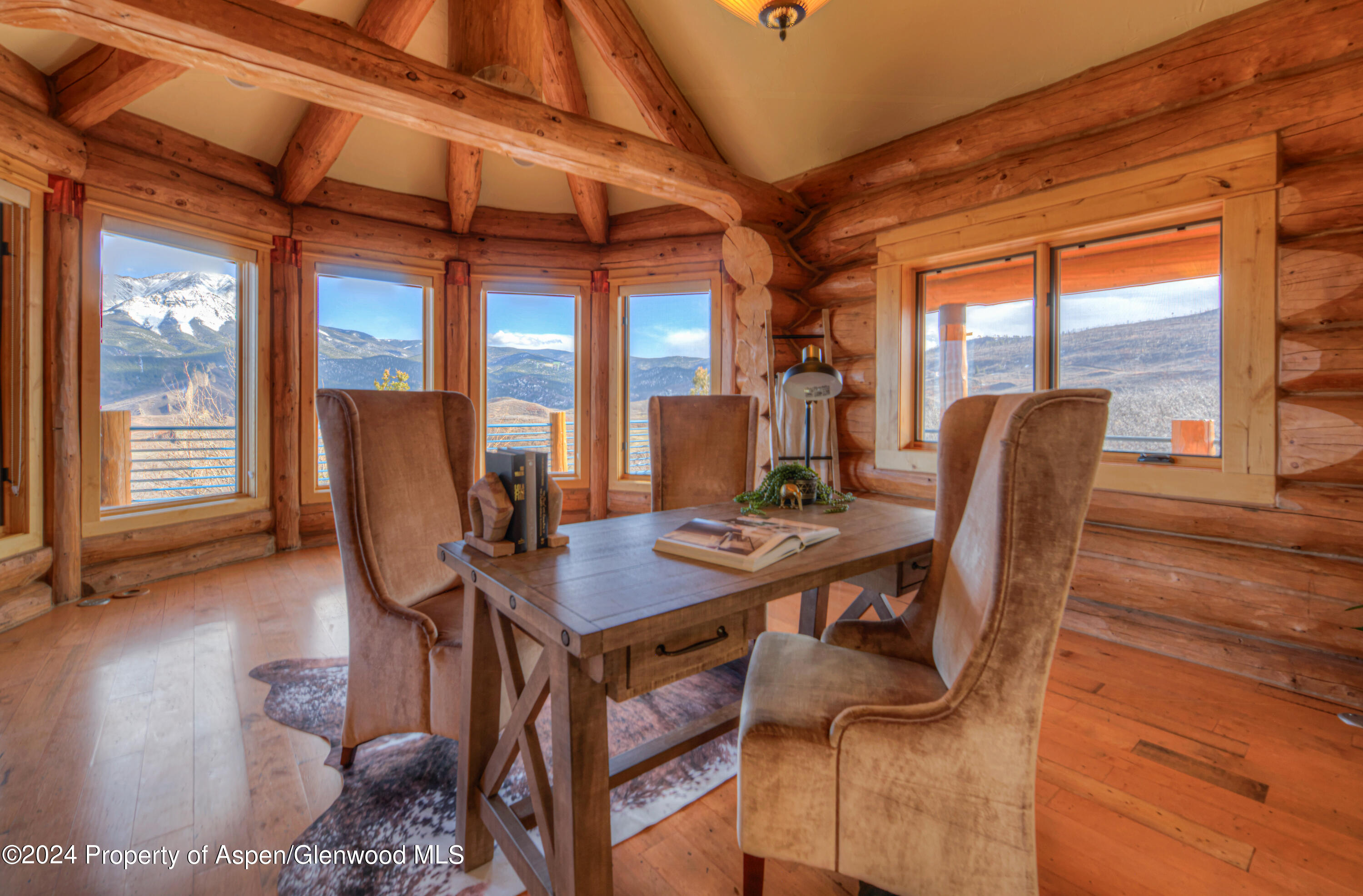 1390 Mountain Valley Road La Veta, CO 81055 - Photo 24 of 43 a dining room with furniture window and wooden floor
