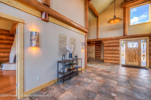 a view of an entryway with a door