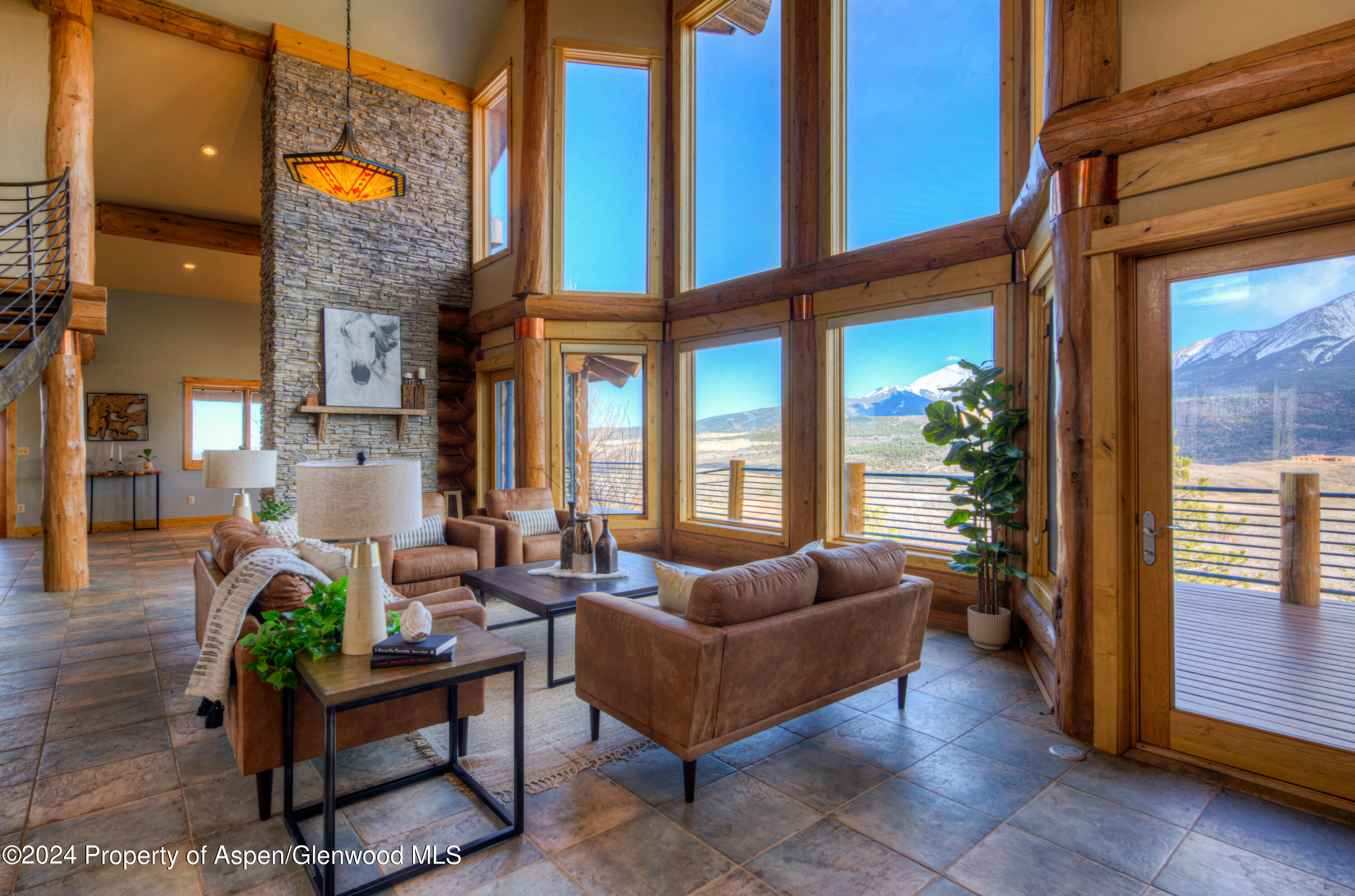 1390 Mountain Valley Road La Veta, CO 81055 - Photo 10 of 43 a living room with furniture a lamp and a potted plant