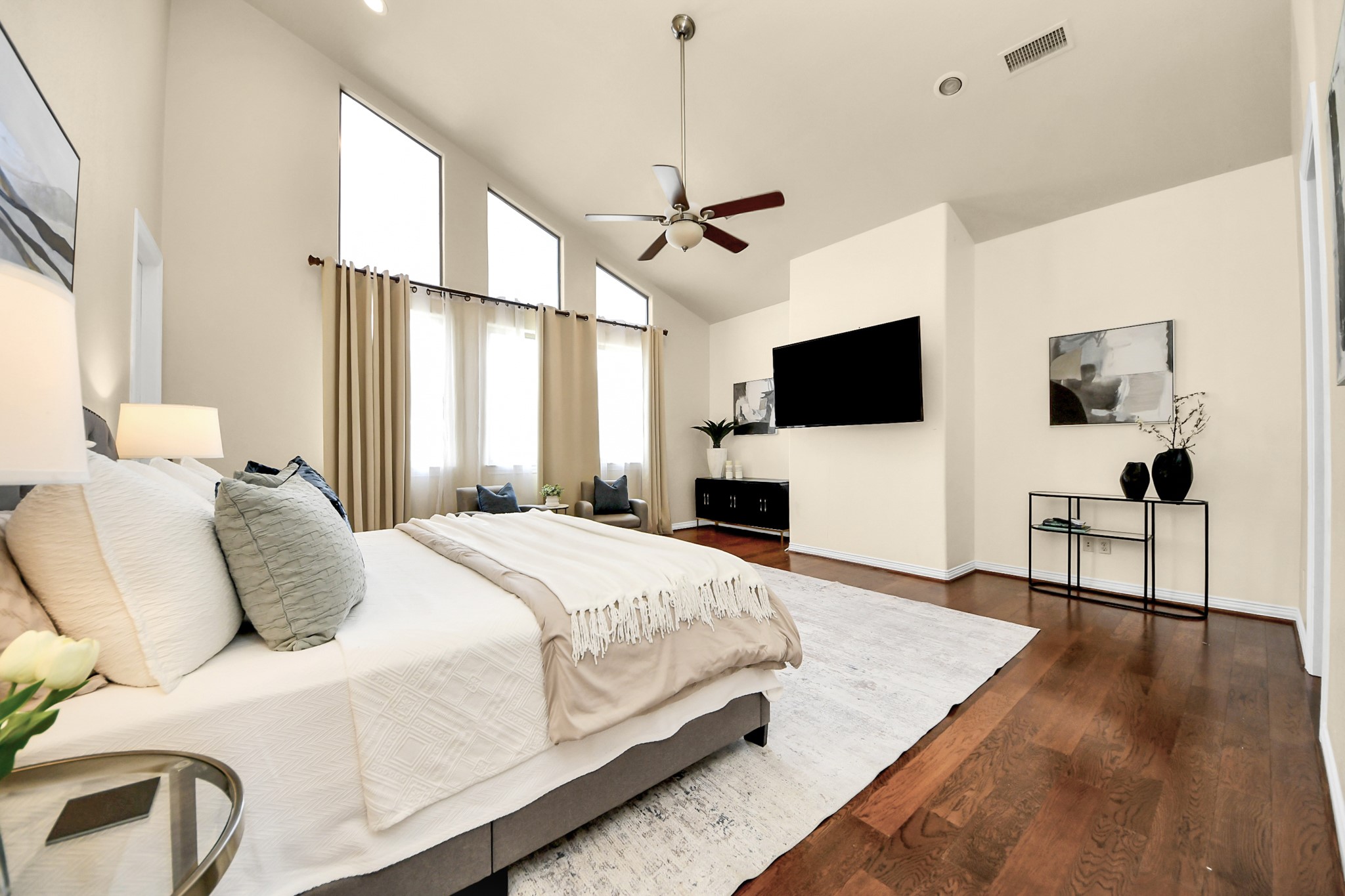 3507 Jackson Street Houston, TX 77004 - Photo 18 of 29 a bedroom with a bed and a flat screen tv