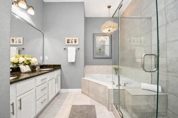 a bathroom with double sink and a mirror