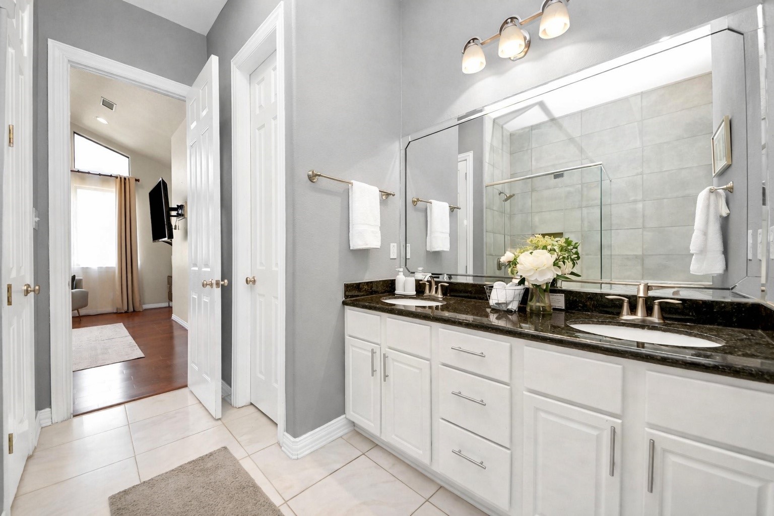 3507 Jackson Street Houston, TX 77004 - Photo 23 of 29 a bathroom with double sink and a mirror
