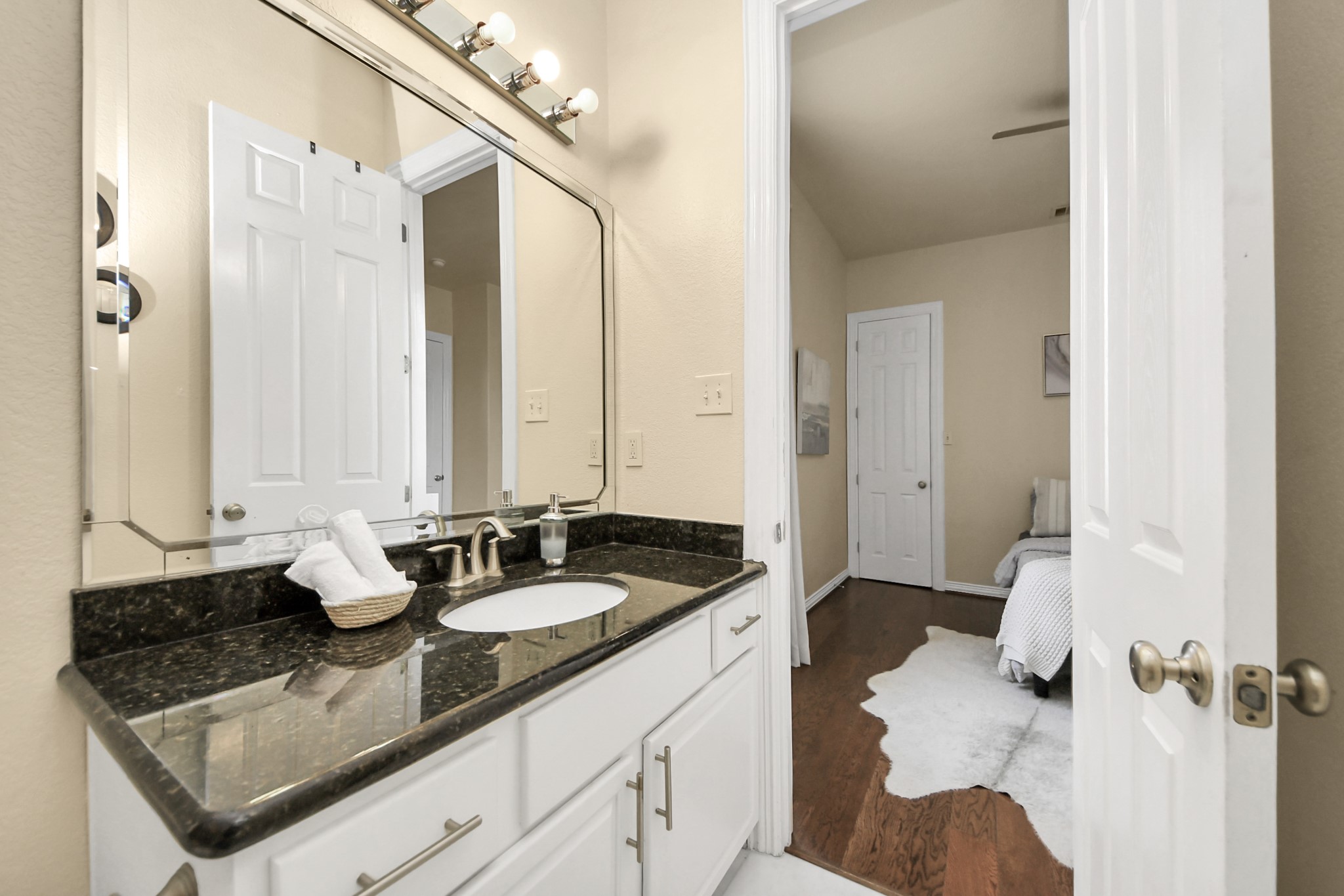 3507 Jackson Street Houston, TX 77004 - Photo 25 of 29 a bathroom with a granite countertop sink and a mirror