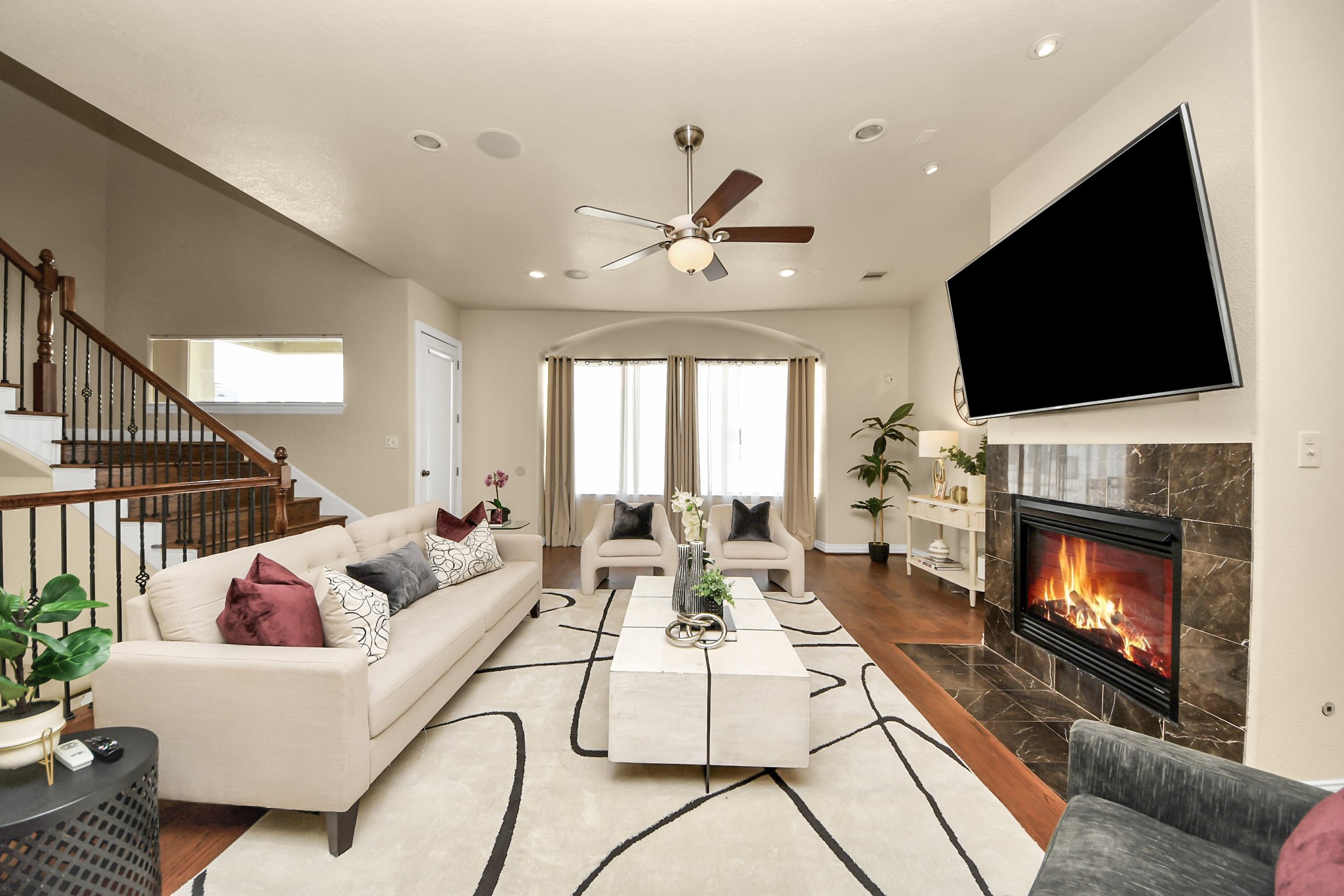 3507 Jackson Street Houston, TX 77004 - Photo 6 of 29 a living room with furniture a fireplace and a flat screen tv