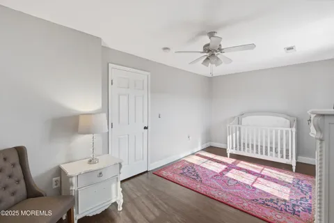 a bedroom with furniture and a rug