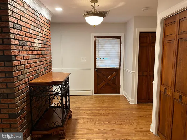 a view of a livingroom with furniture and wooden floor