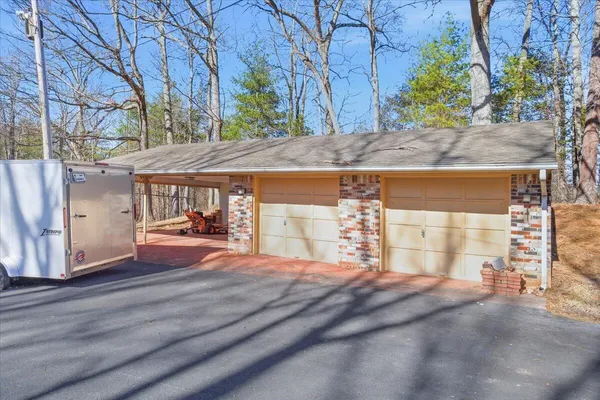 a view of a brick building next to a road