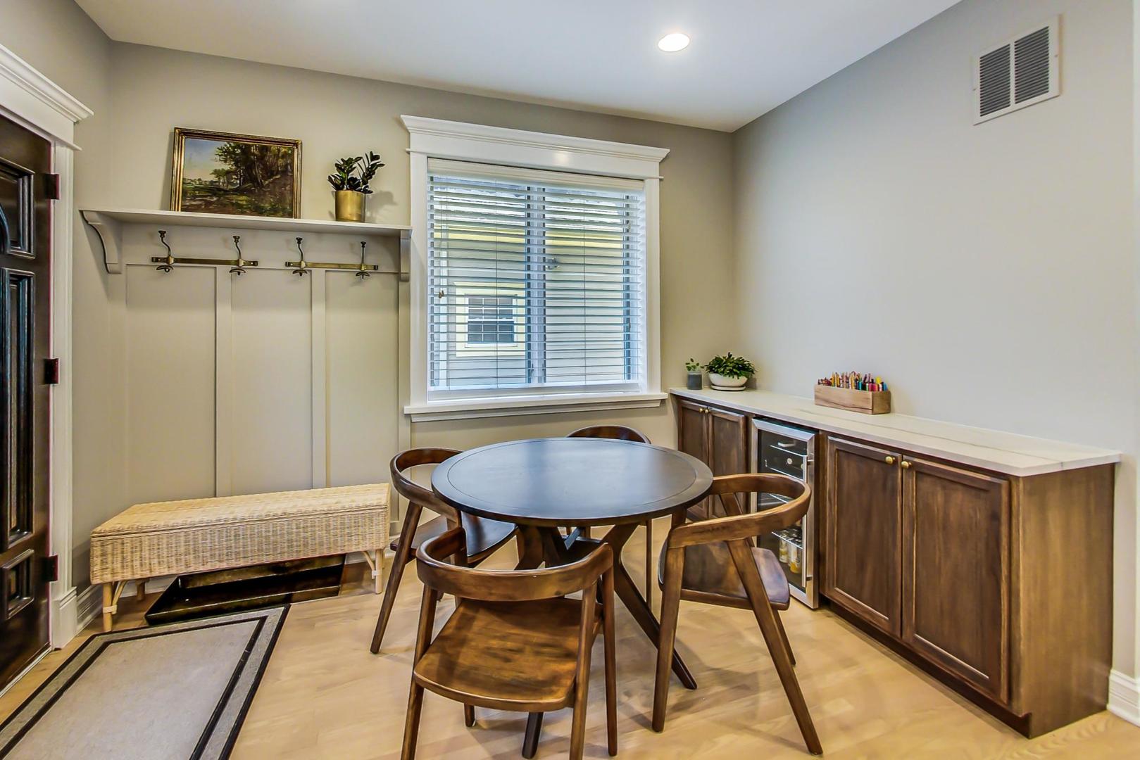 4133 North Kenneth Avenue Chicago, IL 60641 - Photo 15 of 54 a dining room with a table and chairs