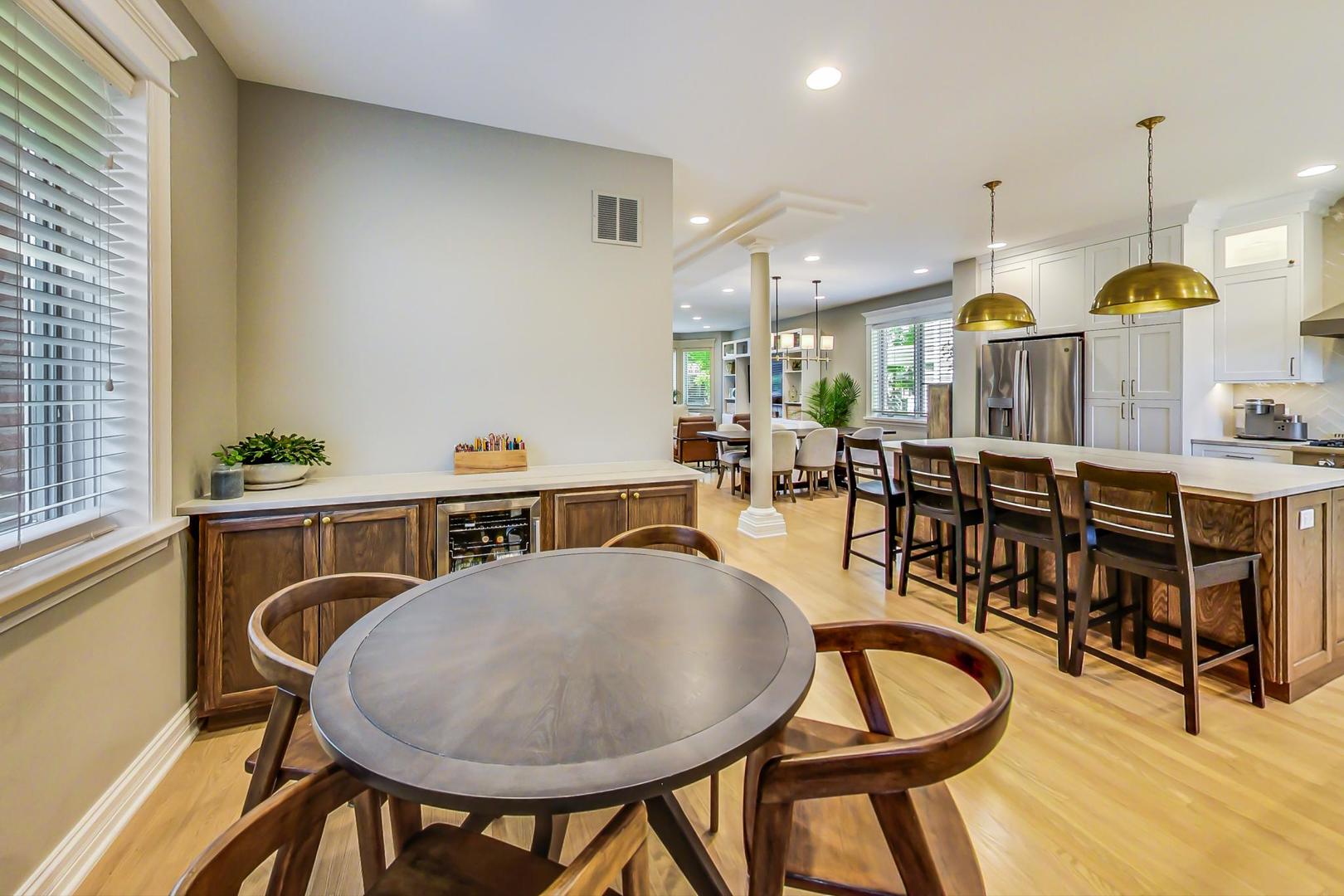 4133 North Kenneth Avenue Chicago, IL 60641 - Photo 16 of 54 a living room with furniture a table and chairs