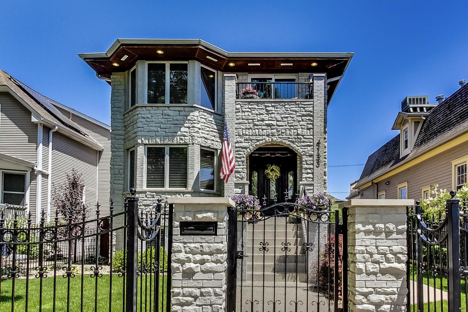 4133 North Kenneth Avenue Chicago, IL 60641 - Photo 2 of 54 a front view of a house with balcony