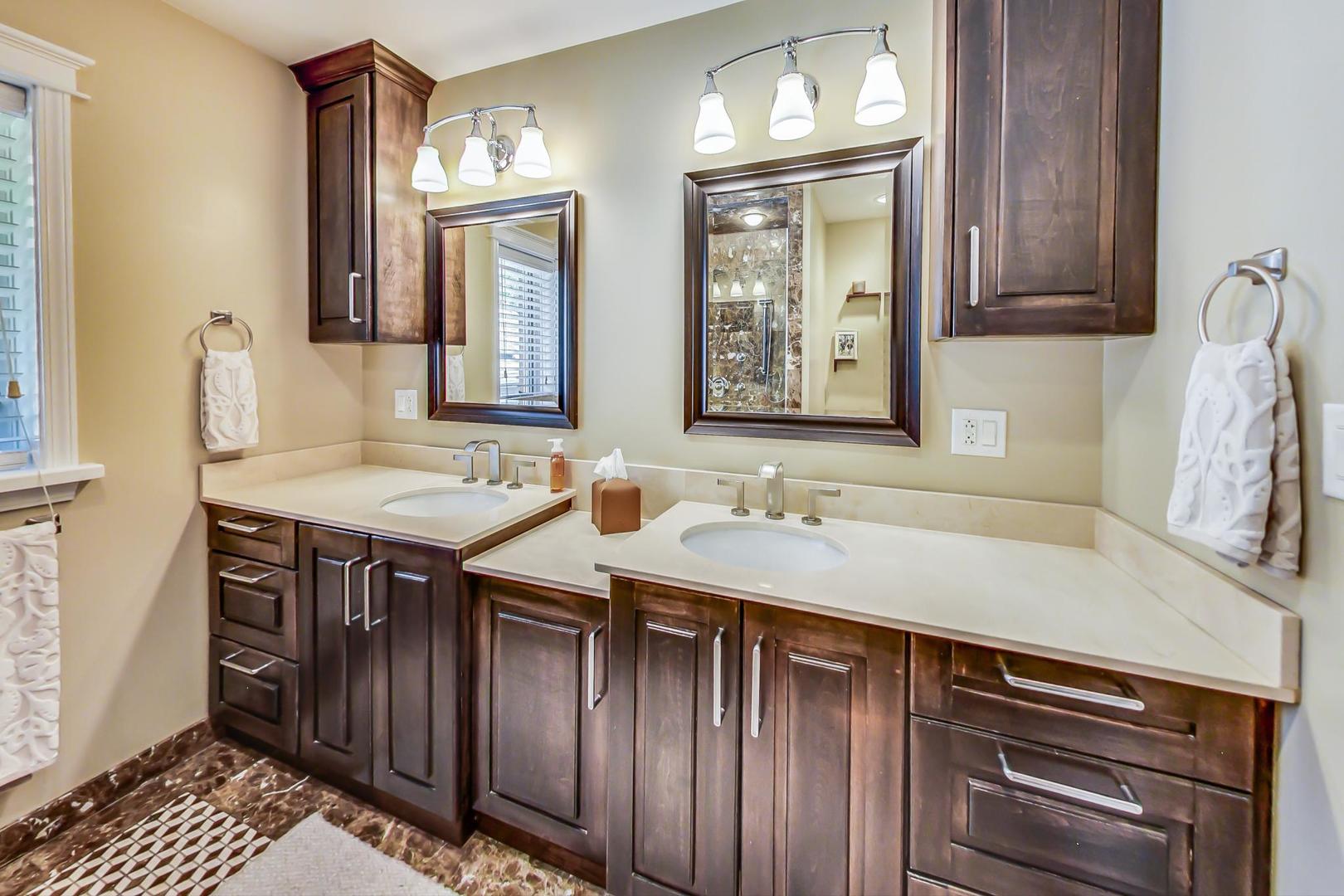 4133 North Kenneth Avenue Chicago, IL 60641 - Photo 24 of 54 a bathroom with a sink and a mirror