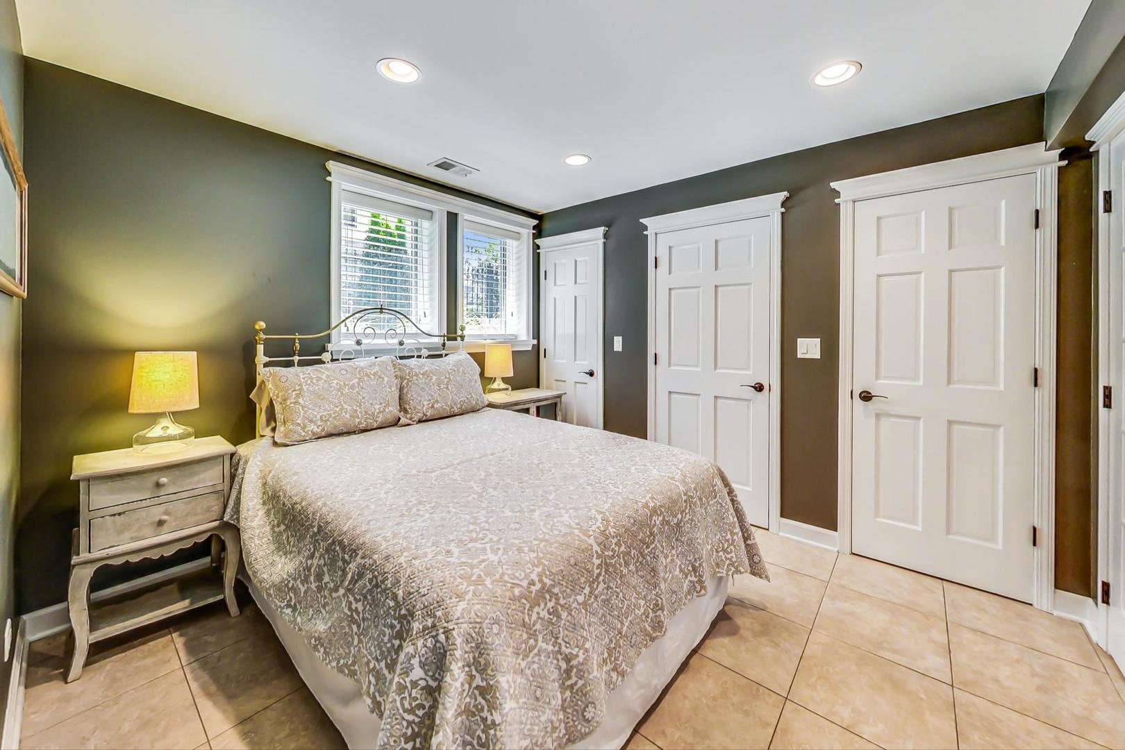 4133 North Kenneth Avenue Chicago, IL 60641 - Photo 36 of 54 a spacious bedroom with a bed and a shower