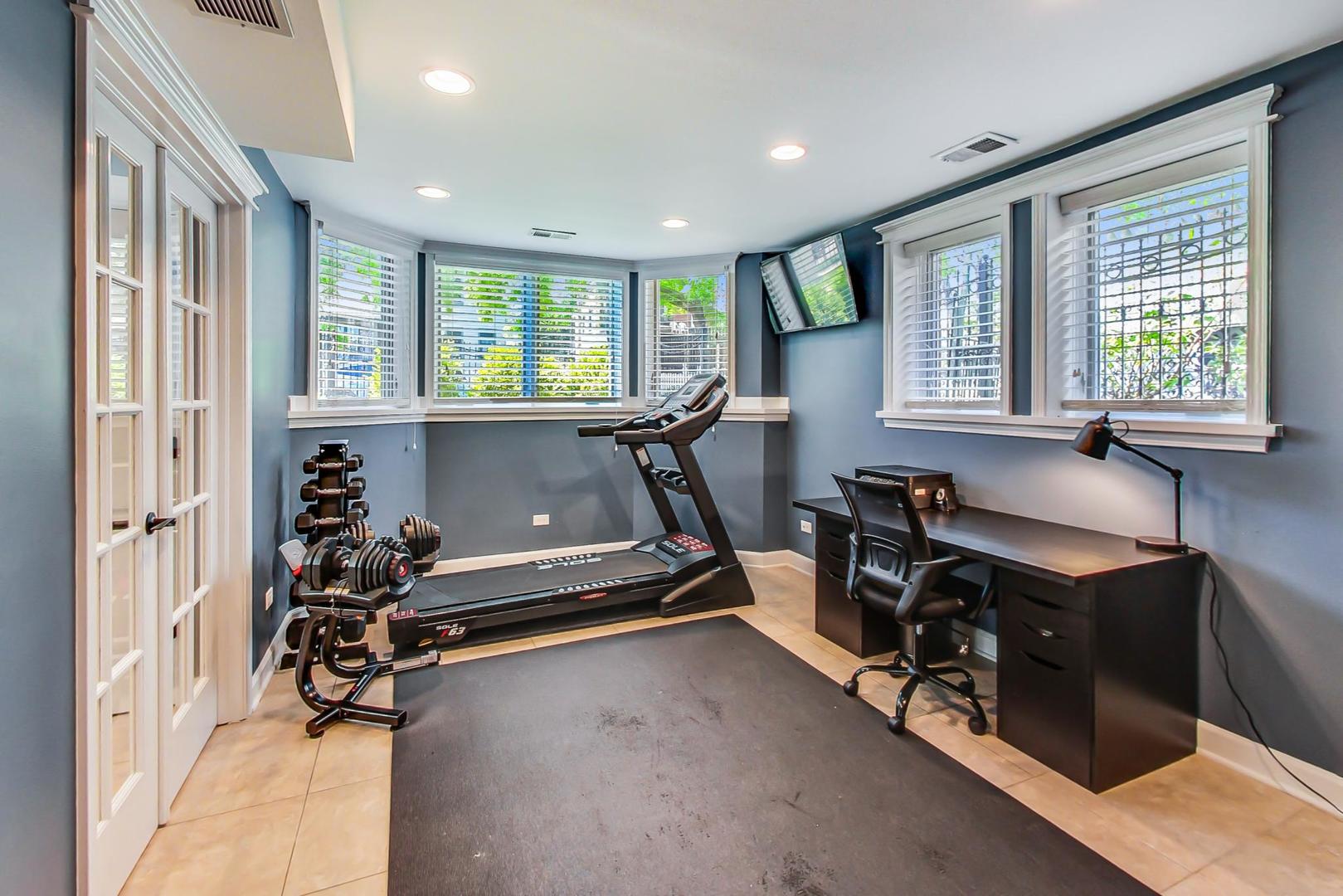 4133 North Kenneth Avenue Chicago, IL 60641 - Photo 40 of 54 a view of a room with gym equipment