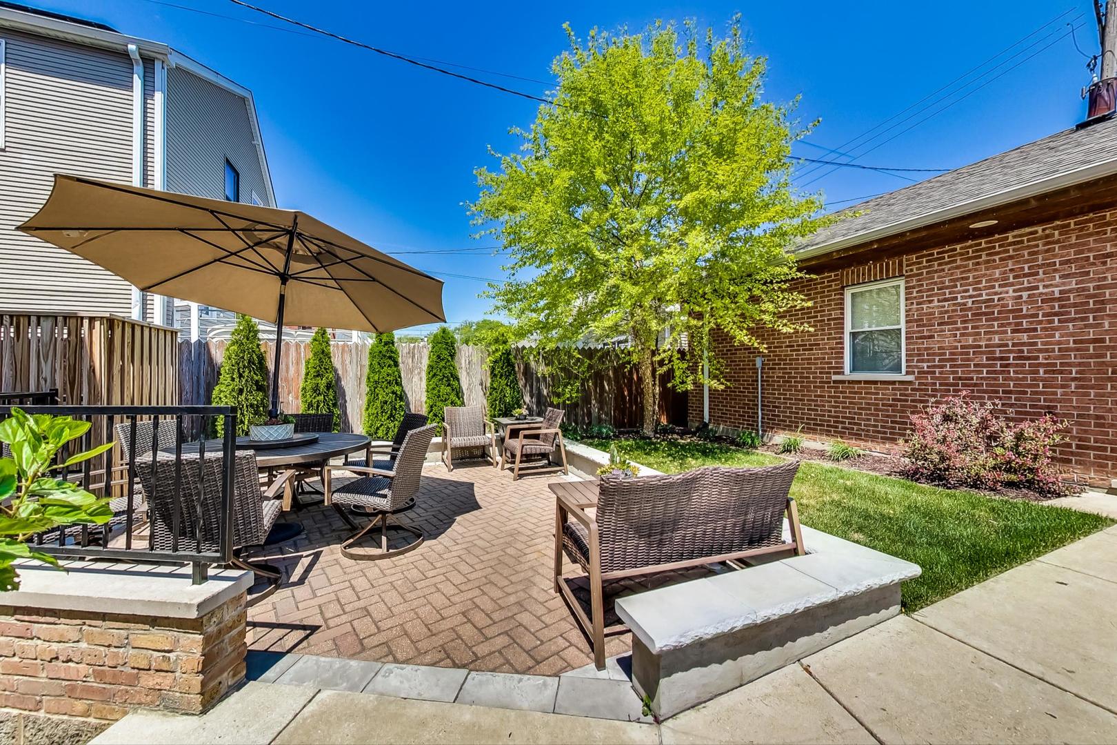 4133 North Kenneth Avenue Chicago, IL 60641 - Photo 47 of 54 a view of backyard with outdoor seating and plants