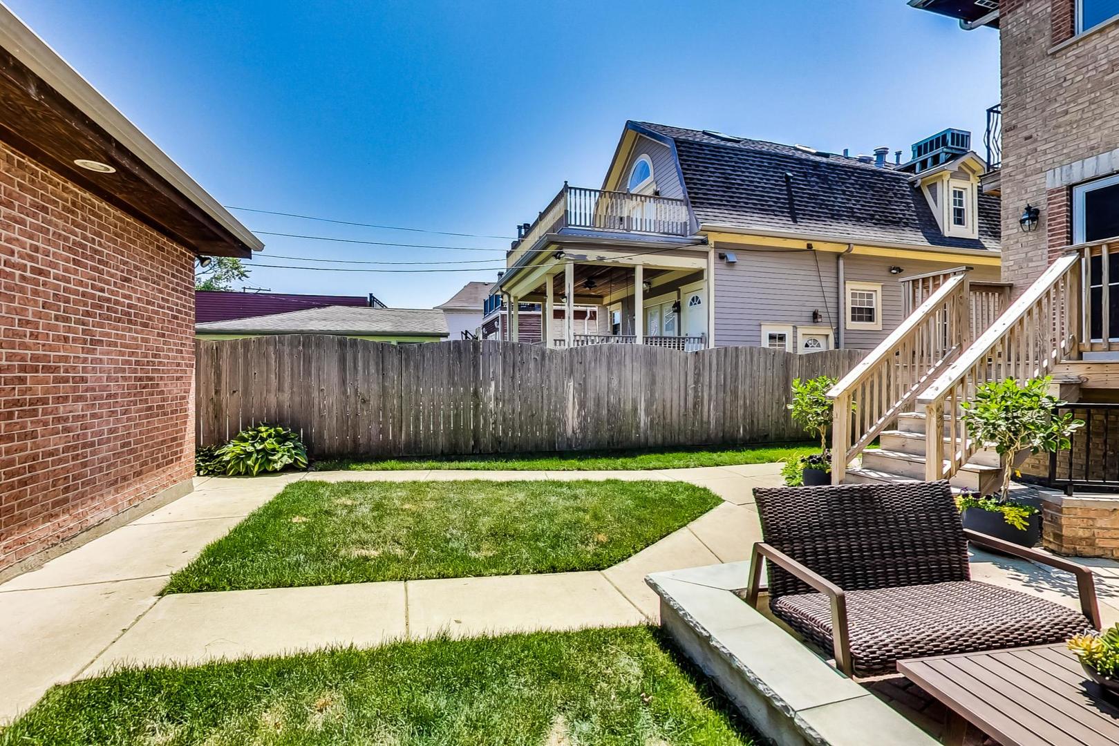 4133 North Kenneth Avenue Chicago, IL 60641 - Photo 49 of 54 a house view with a seating space