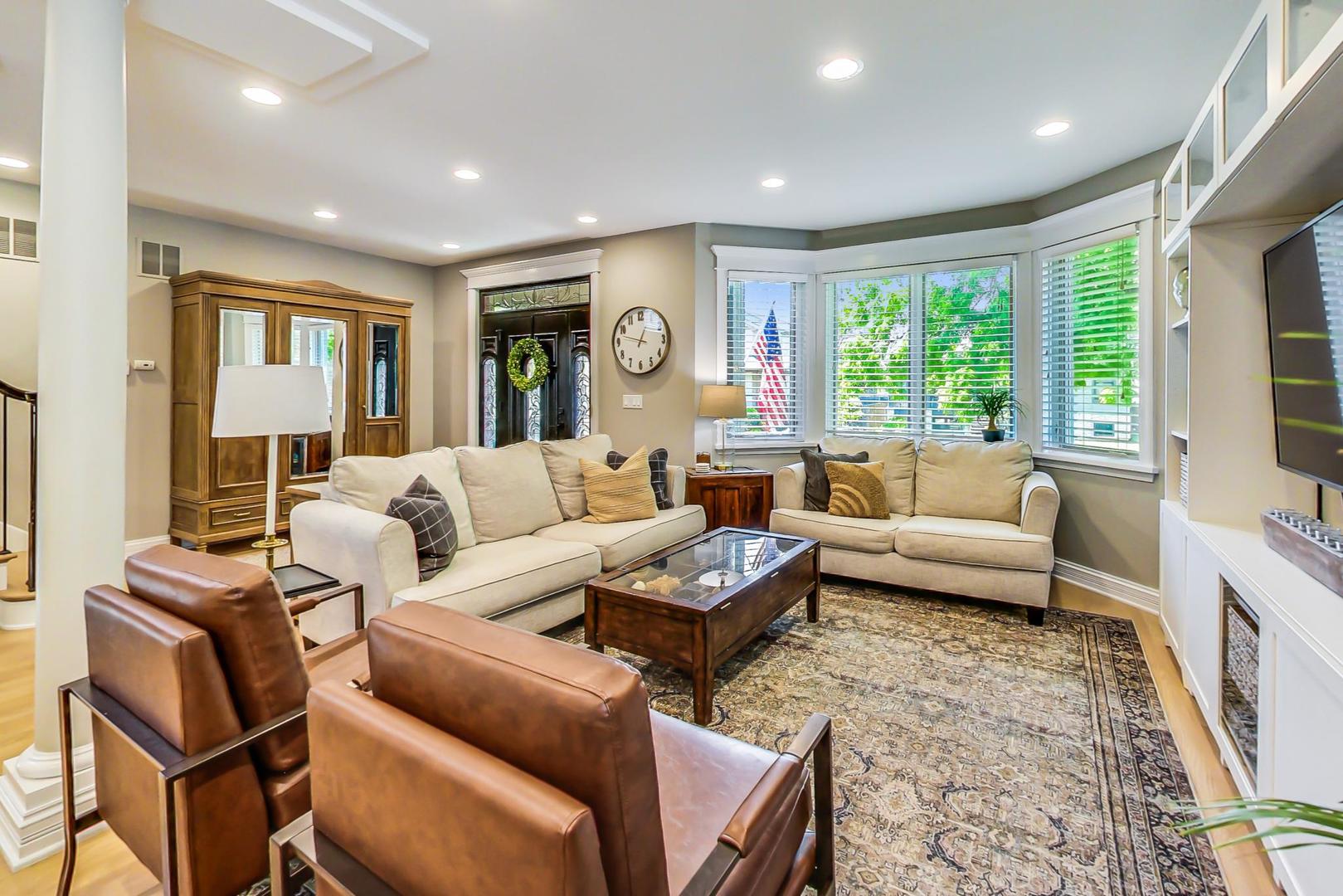 4133 North Kenneth Avenue Chicago, IL 60641 - Photo 7 of 54 a living room with furniture and a large window