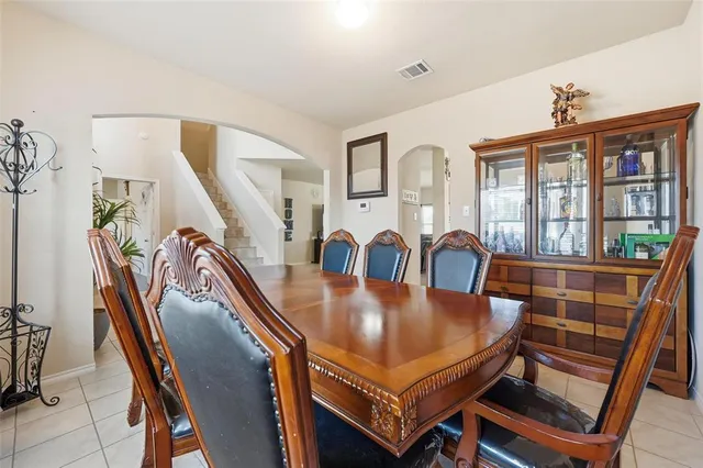 a dining room with furniture and window