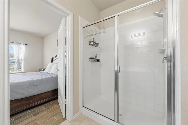 a bathroom with a shower and a tub