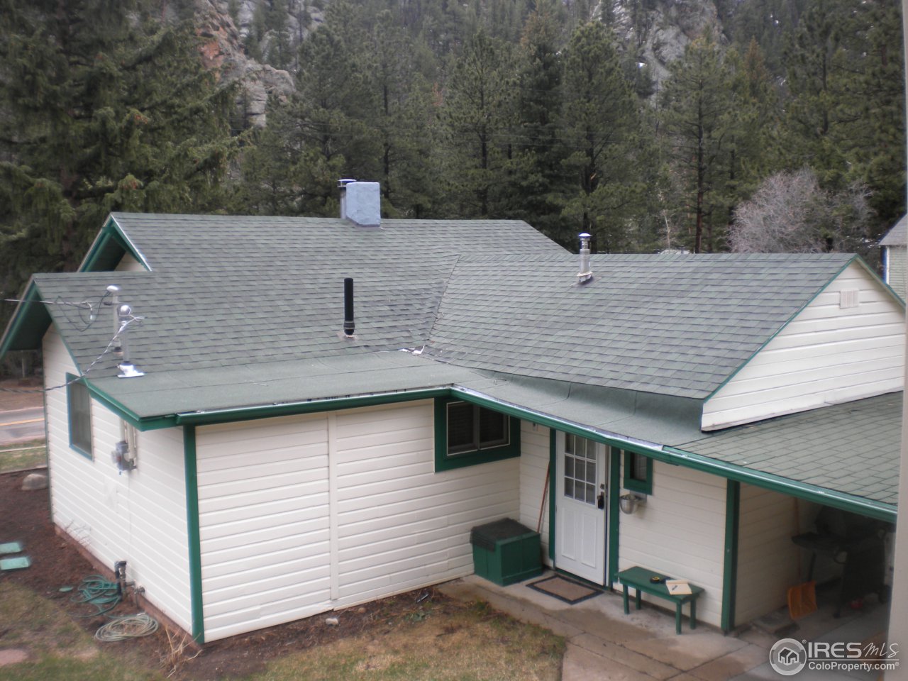 2834 Riverside Drive Lyons, CO 80540 - Photo 11 of 13 a side view of a house with a yard
