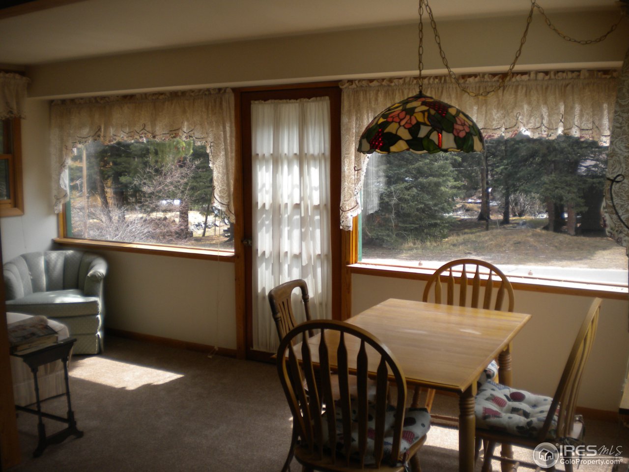 2834 Riverside Drive Lyons, CO 80540 - Photo 2 of 13 a view of a dining room with furniture window and outside view