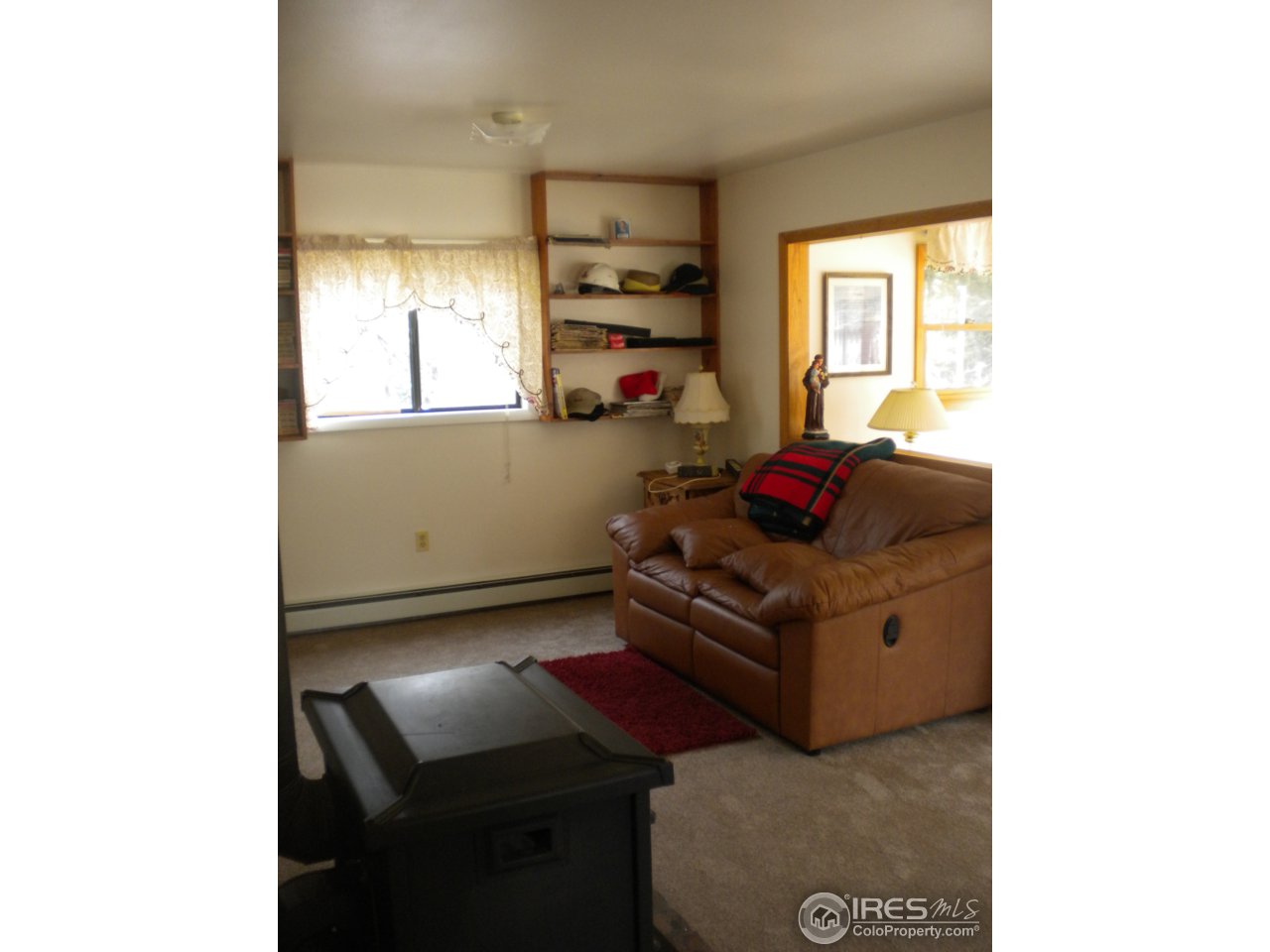 2834 Riverside Drive Lyons, CO 80540 - Photo 3 of 13 a living room with furniture and a window