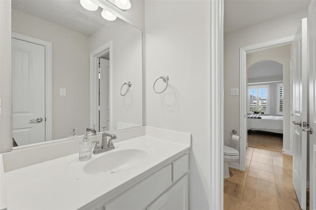 418 Crestview Drive Midlothian, TX 76065 - Photo 22 of 39 Bathroom with vanity, connected bathroom, and light tile patterned flooring