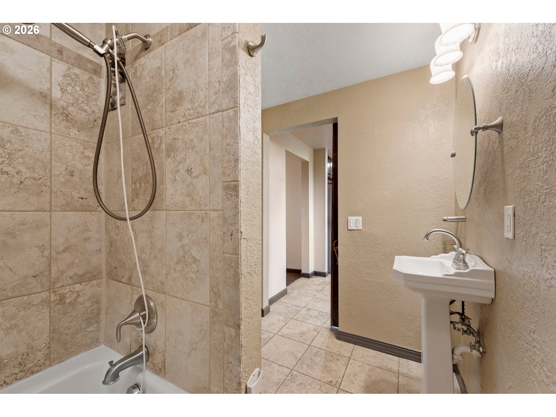58015 Godley Road Union, OR 97883 - Photo 17 of 44 a bathroom with a sink mirror and shower