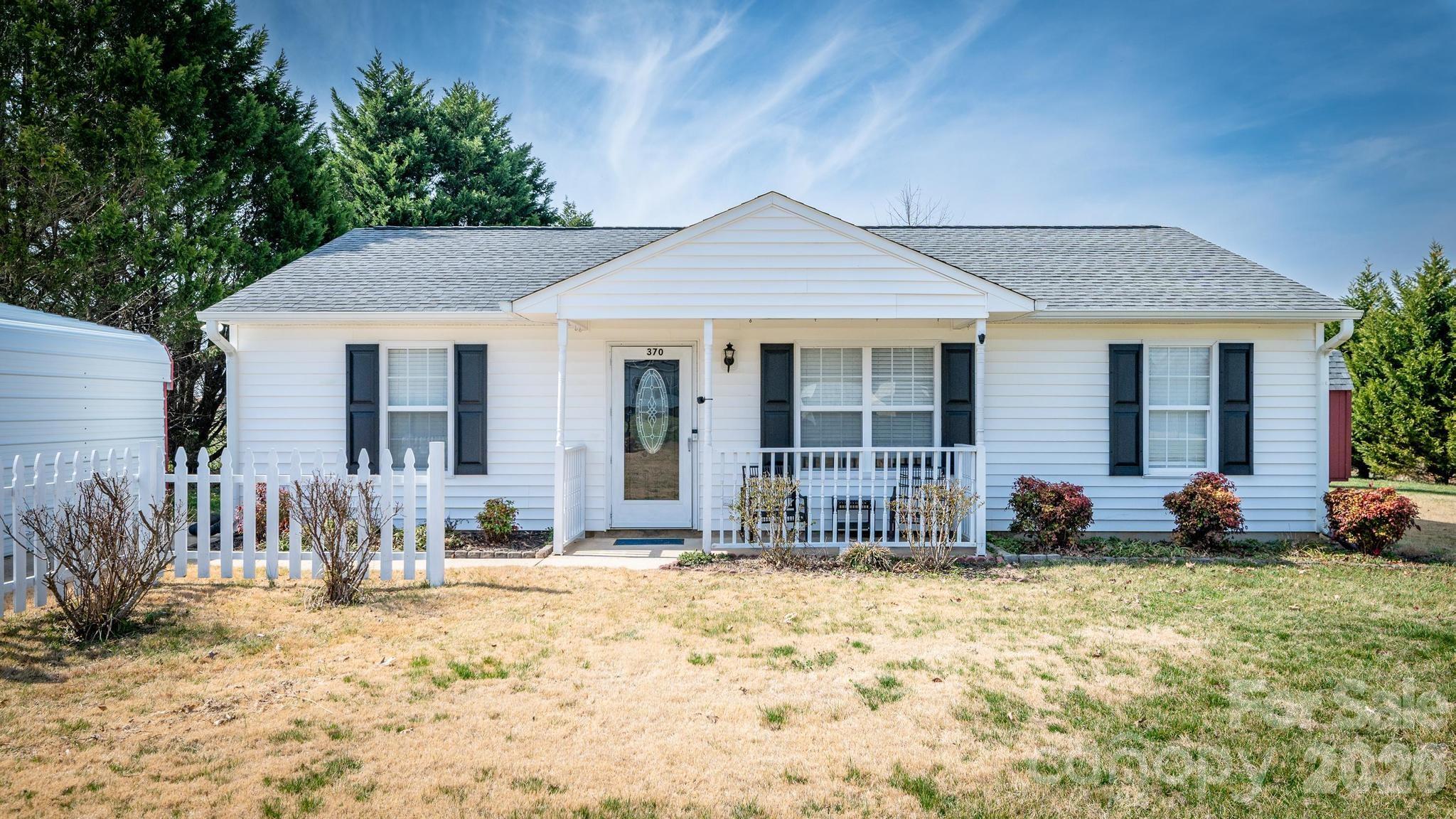 370 Weathers Creek Road Troutman, NC 28166 - Photo 1 of 10 a front view of a house with a yard