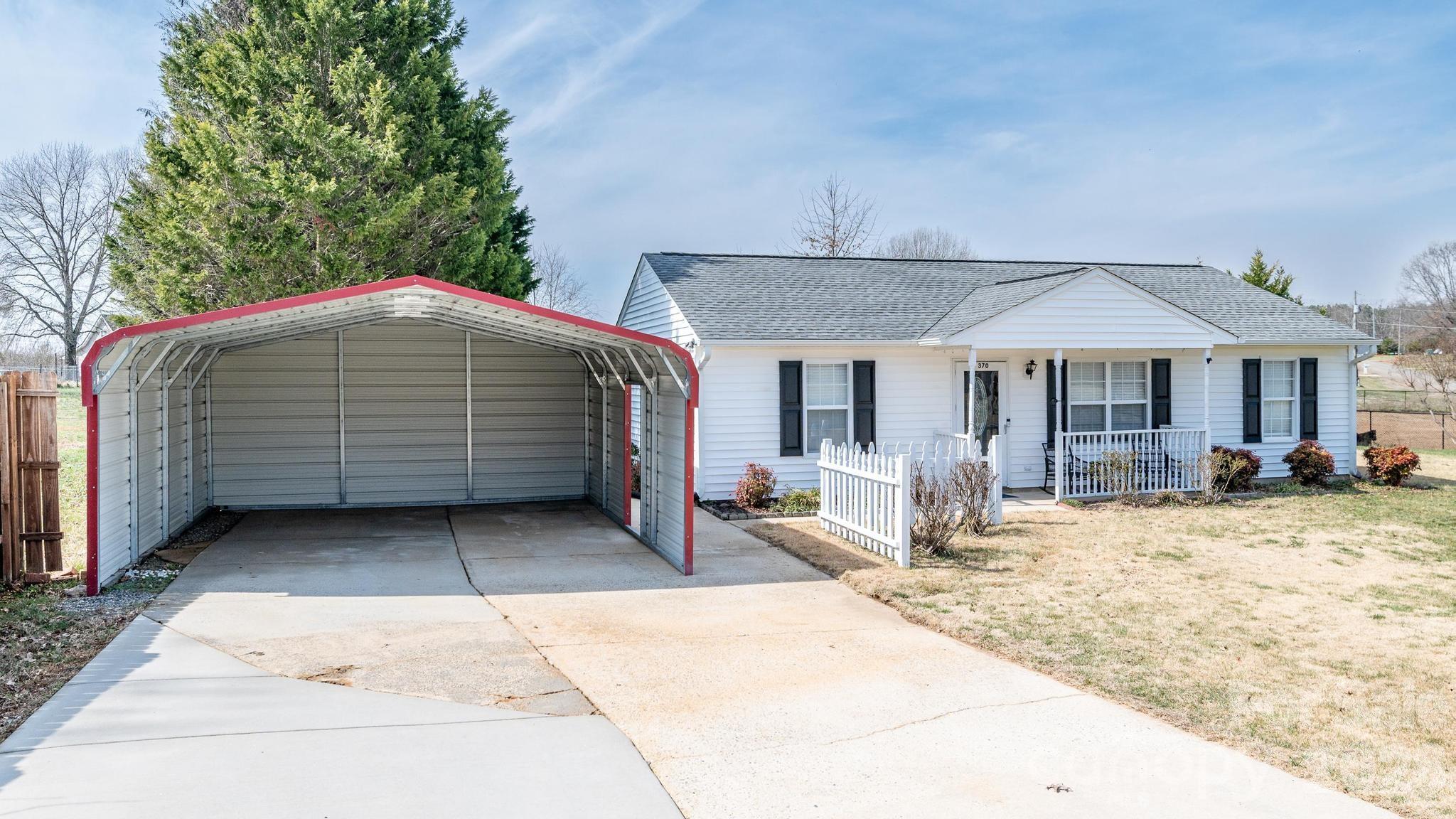 370 Weathers Creek Road Troutman, NC 28166 - Photo 3 of 10 a house with yard in front of it
