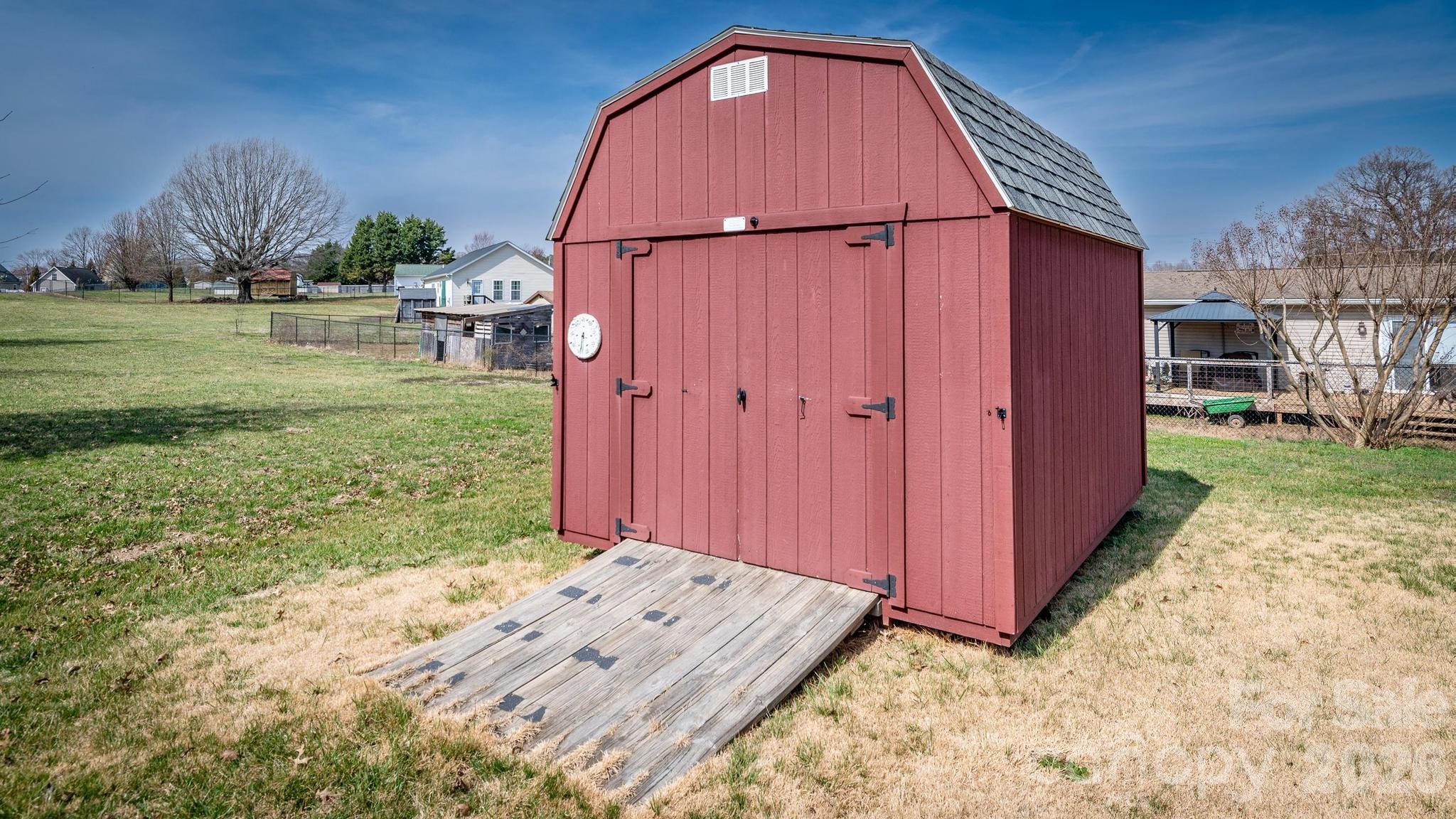 370 Weathers Creek Road Troutman, NC 28166 - Photo 6 of 10 a backyard of a house with lots of green space