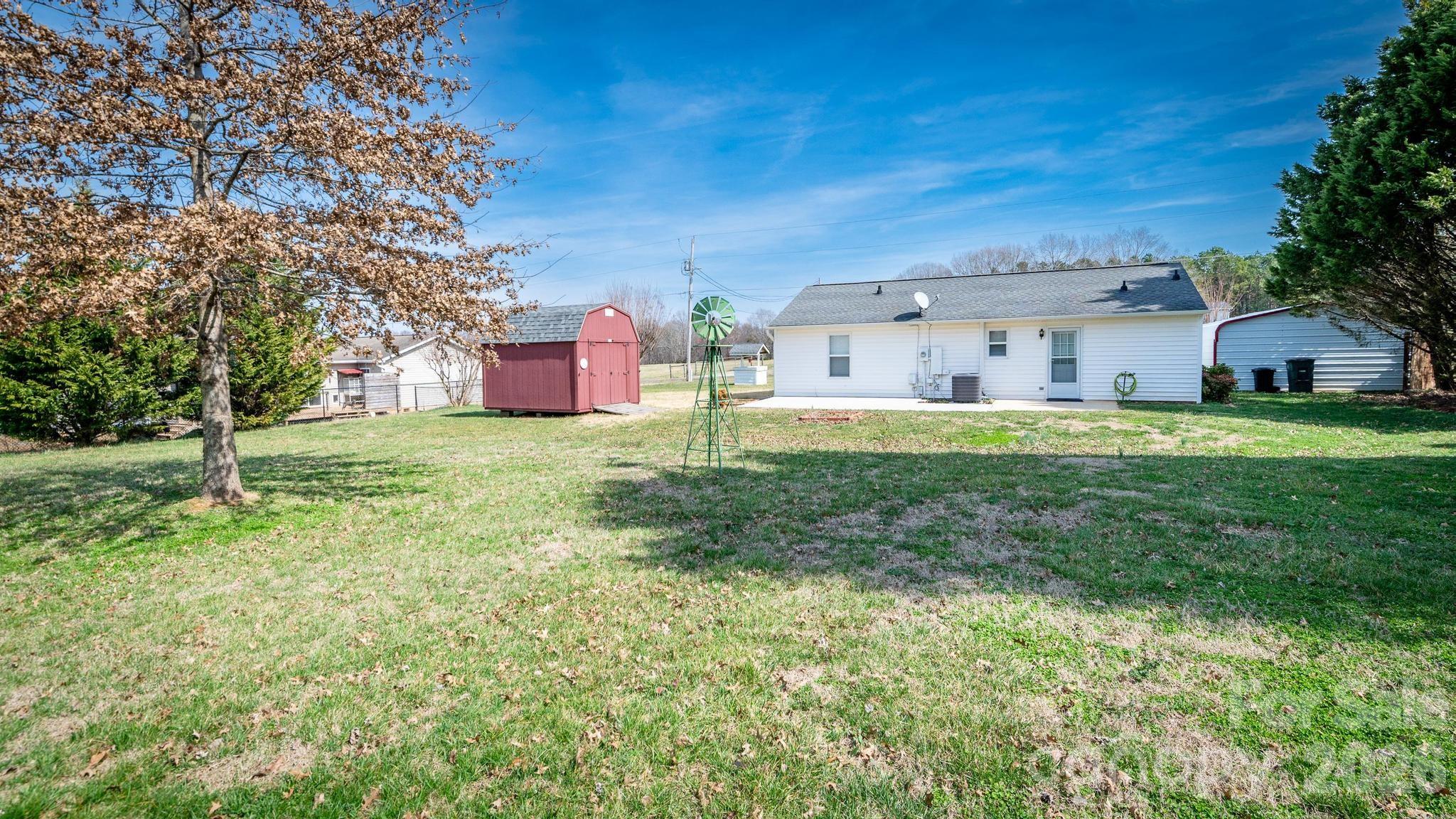 370 Weathers Creek Road Troutman, NC 28166 - Photo 9 of 10 a house view with a sitting space and garden