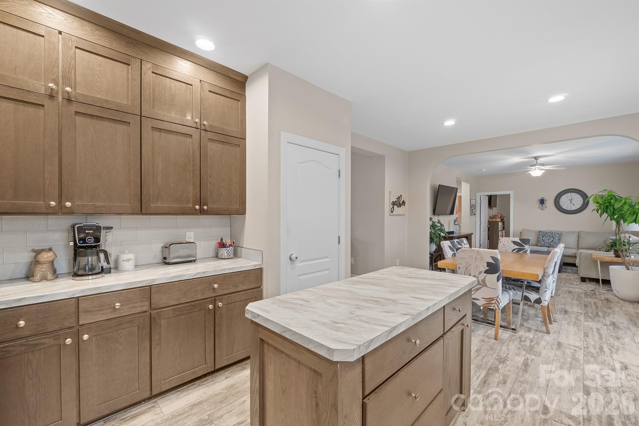 486 Stutts Road Mooresville, NC 28117 - Photo 11 of 35 a kitchen with a sink cabinets and wooden floor