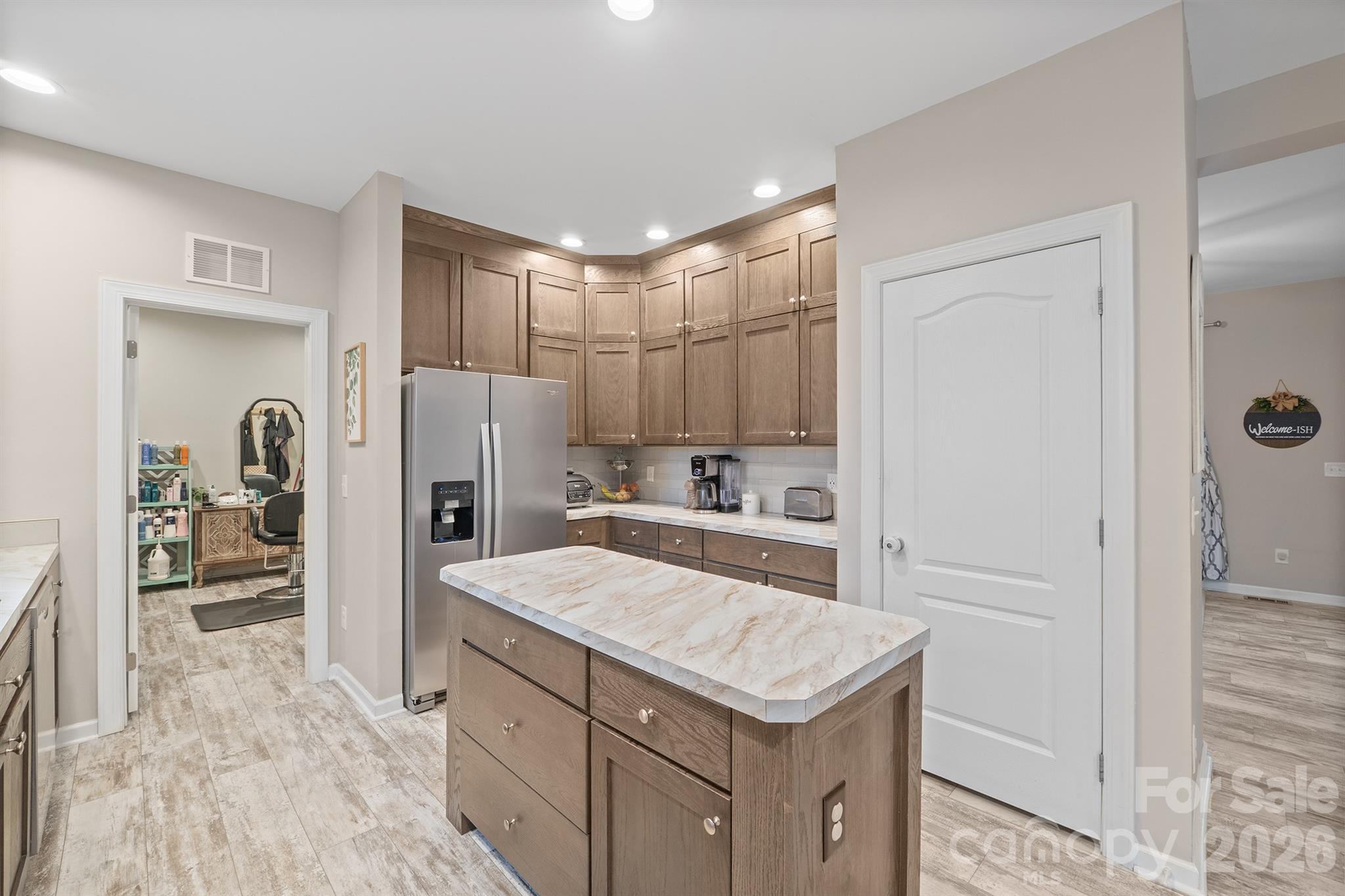486 Stutts Road Mooresville, NC 28117 - Photo 13 of 35 a kitchen with a refrigerator a sink and cabinets