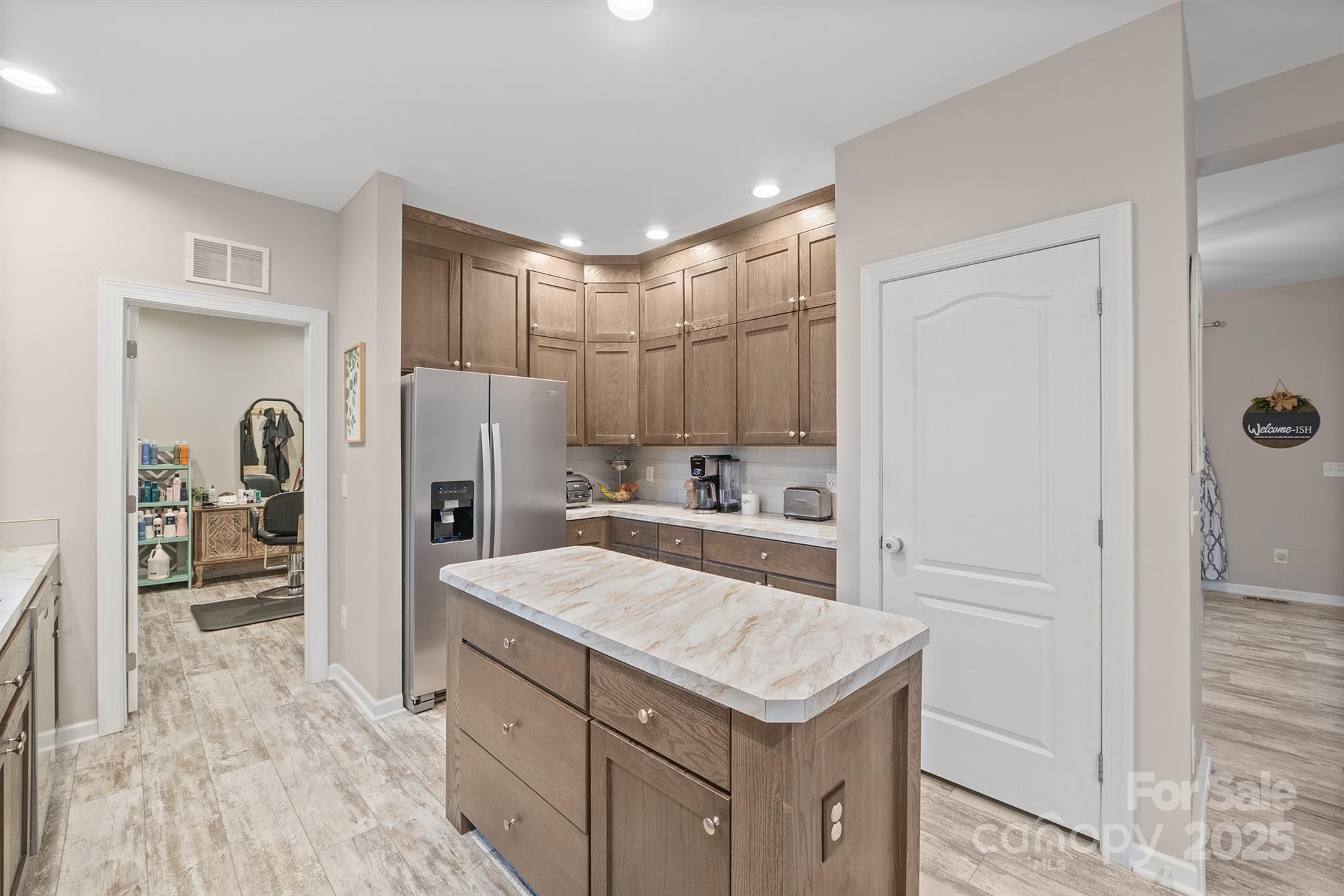 486 Stutts Road Mooresville, NC 28117 - Photo 14 of 35 a kitchen with a refrigerator a sink and cabinets