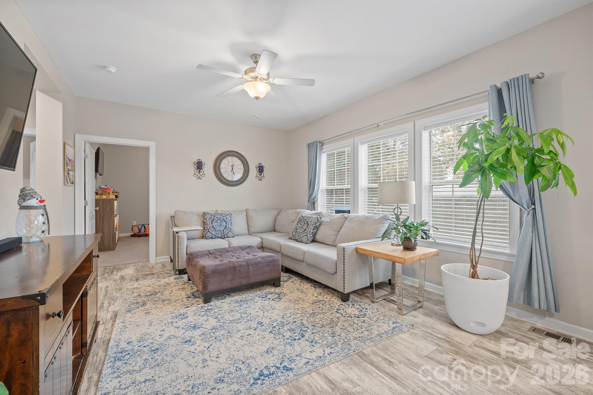 486 Stutts Road Mooresville, NC 28117 - Photo 16 of 35 a living room with furniture and a potted plant