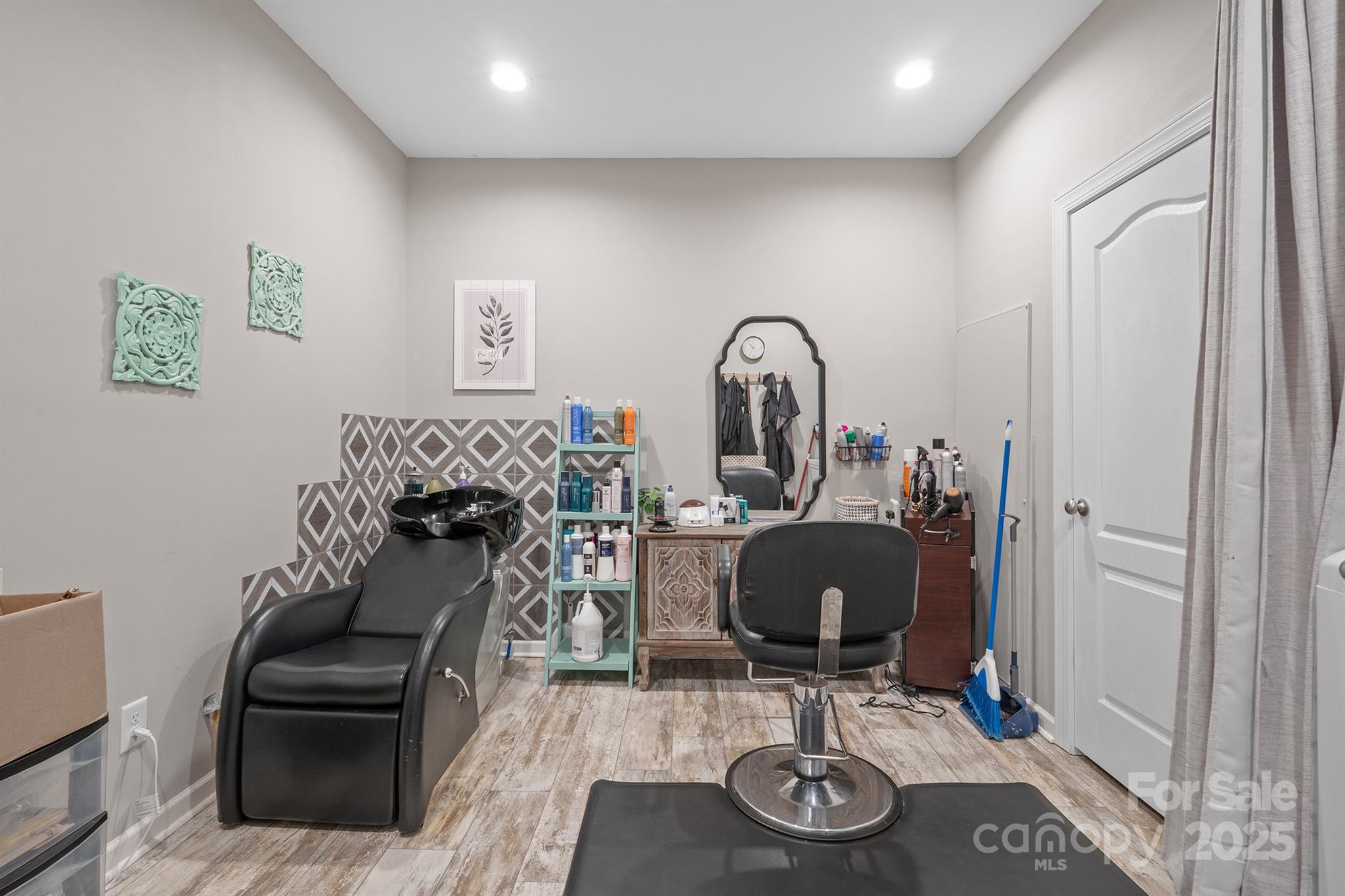 486 Stutts Road Mooresville, NC 28117 - Photo 16 of 35 a view of a workspace with furniture and a mirror
