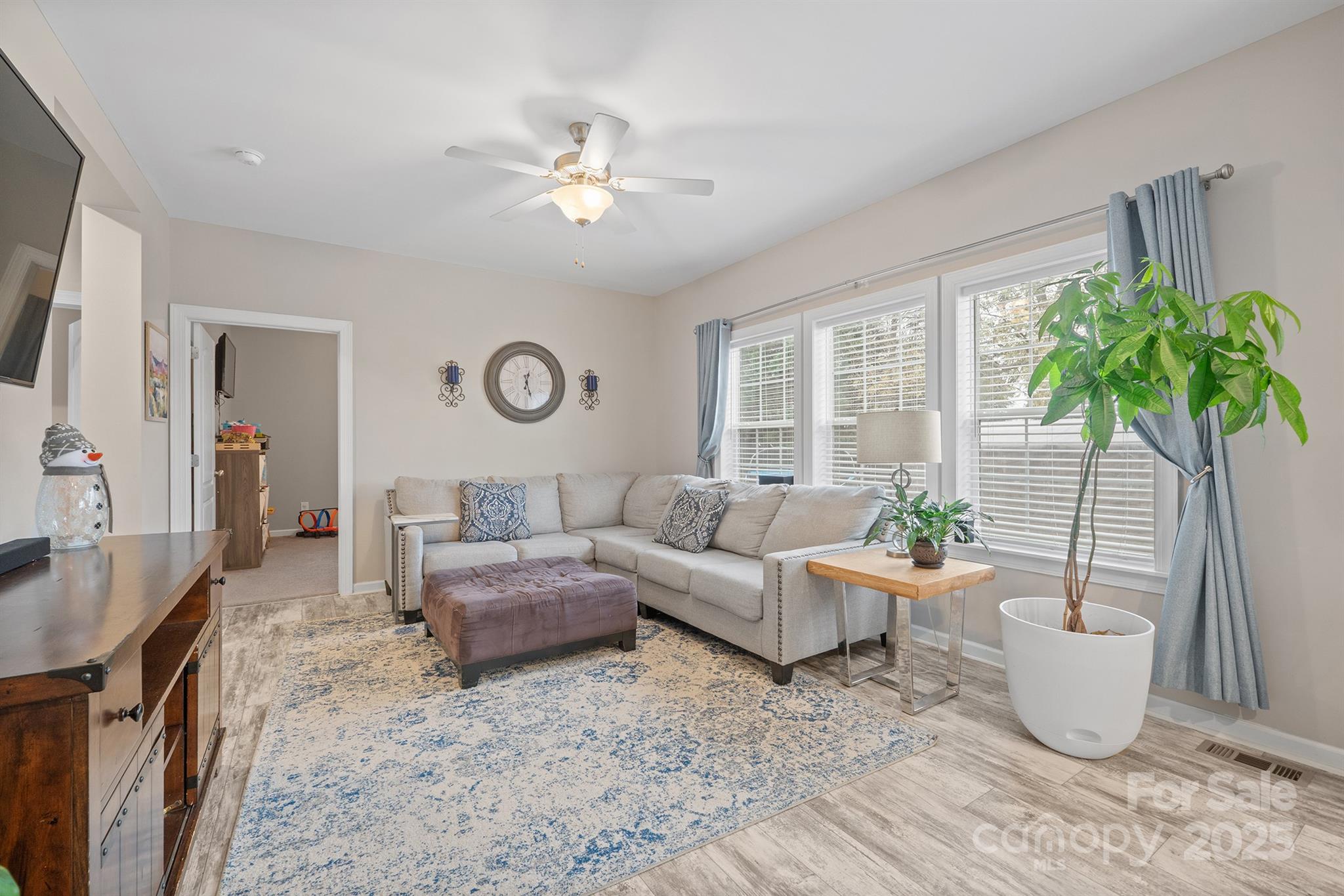 486 Stutts Road Mooresville, NC 28117 - Photo 17 of 35 a living room with furniture and a potted plant