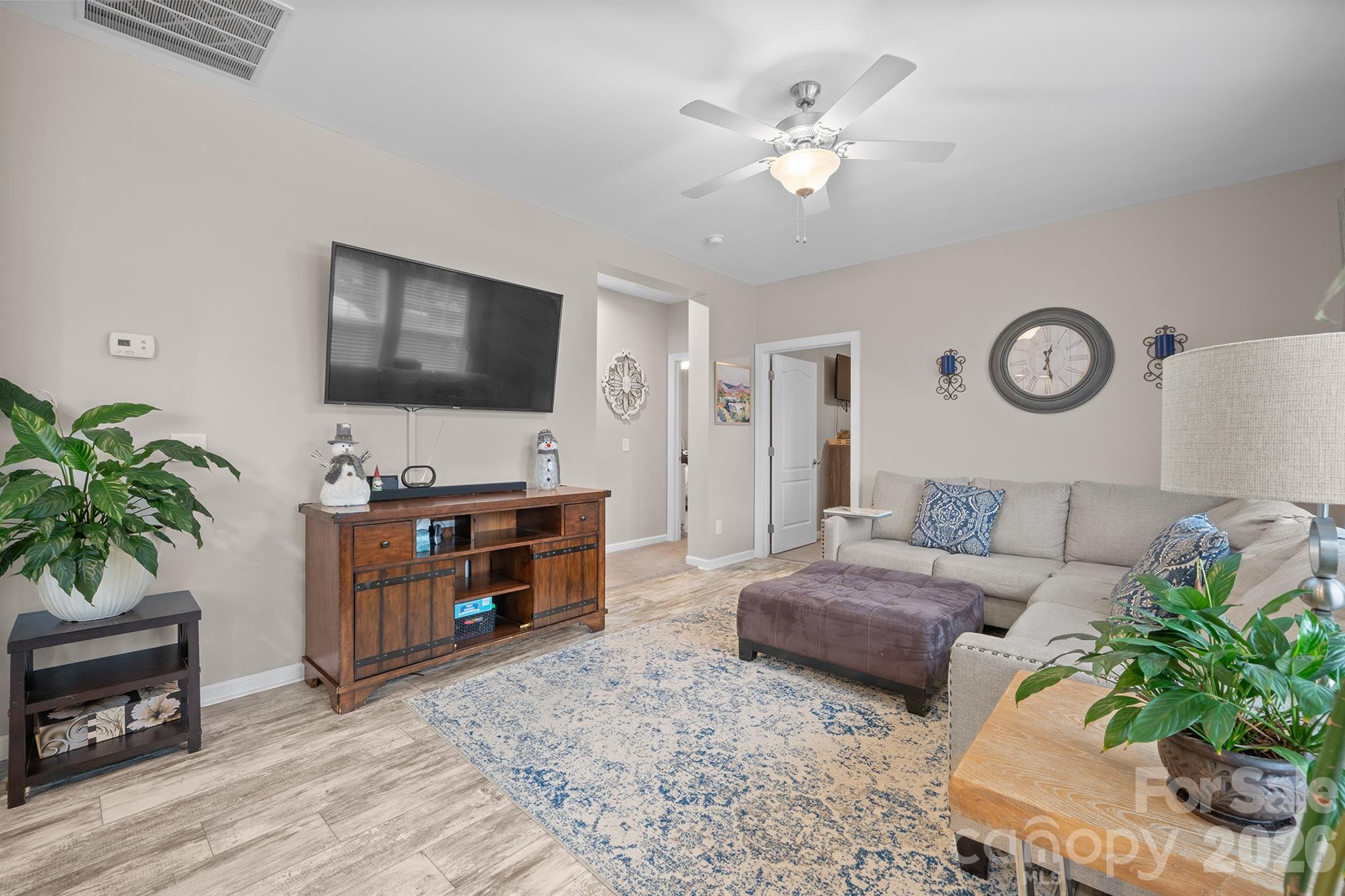 486 Stutts Road Mooresville, NC 28117 - Photo 17 of 35 a living room with furniture and a flat screen tv