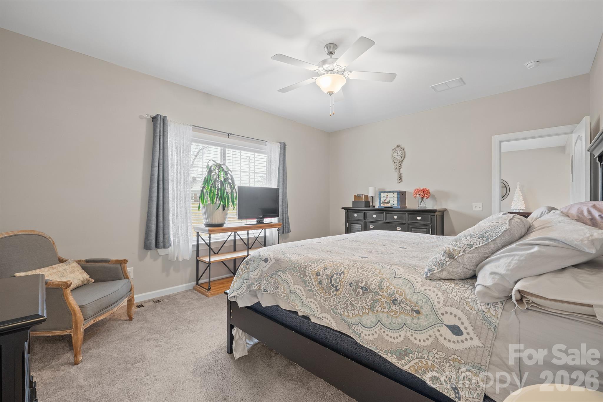 486 Stutts Road Mooresville, NC 28117 - Photo 20 of 35 a bedroom with a bed a table and chair
