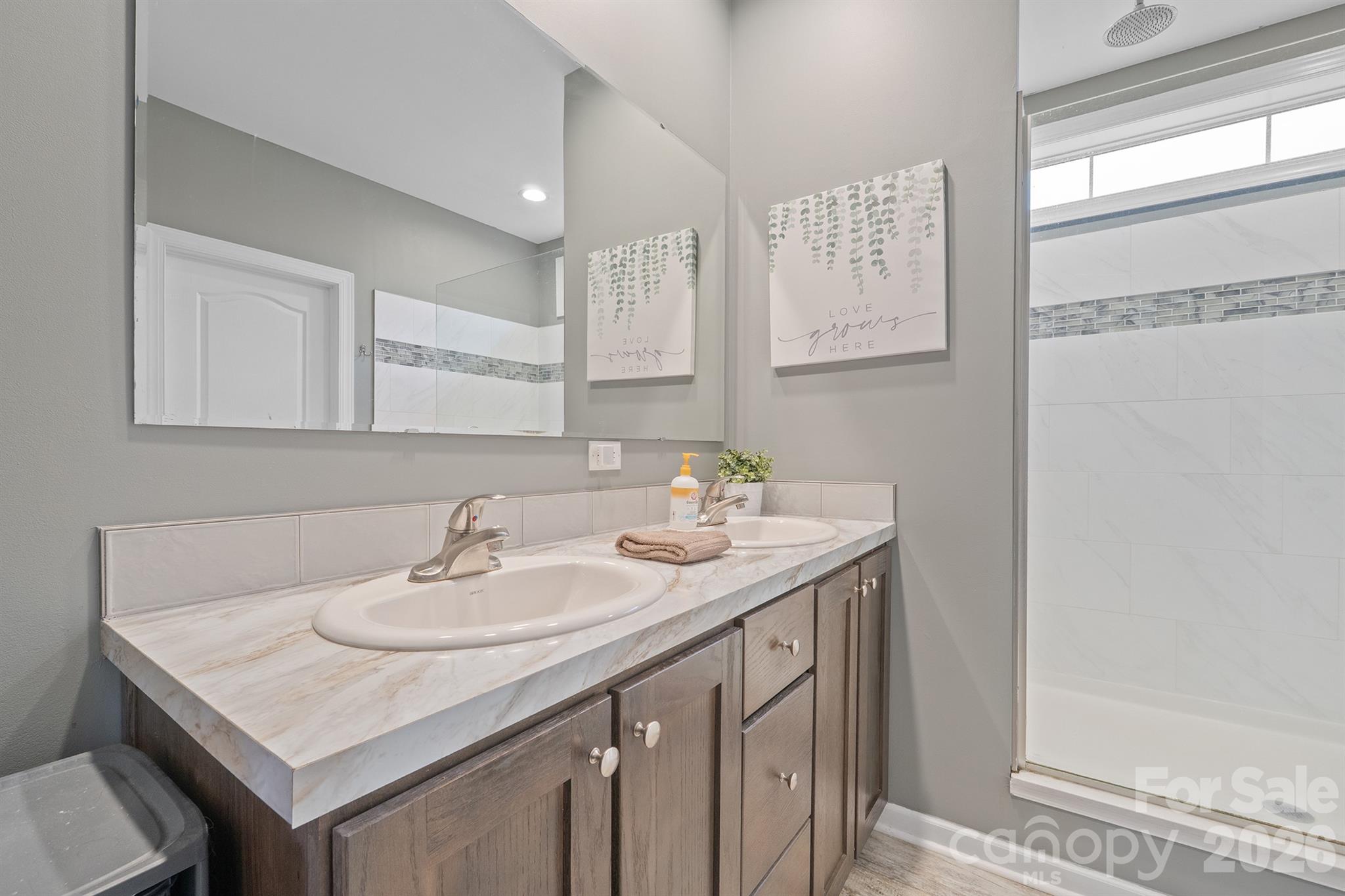 486 Stutts Road Mooresville, NC 28117 - Photo 23 of 35 a bathroom with a sink and a mirror