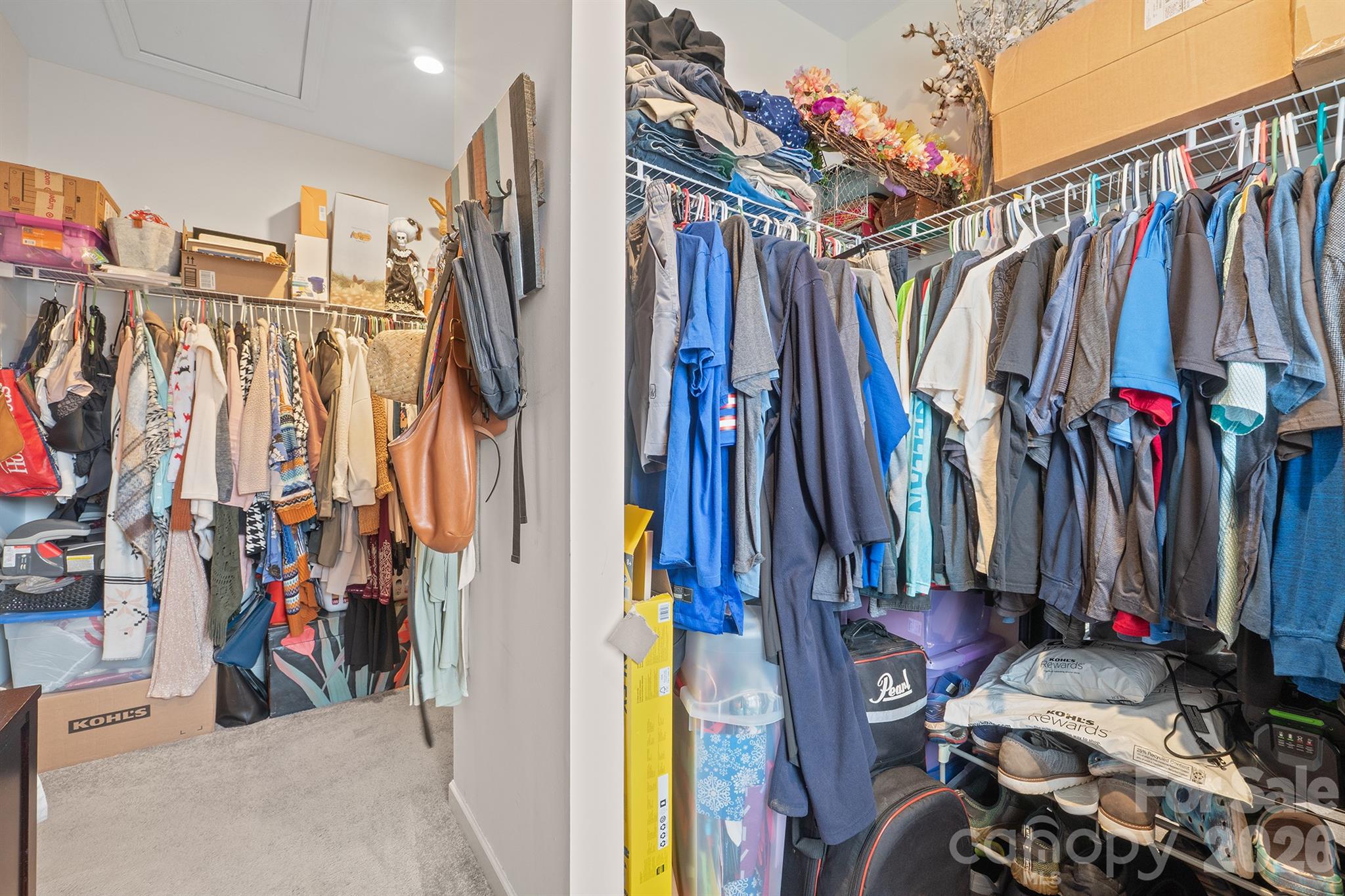 486 Stutts Road Mooresville, NC 28117 - Photo 24 of 35 a view of walk in closet with clothes