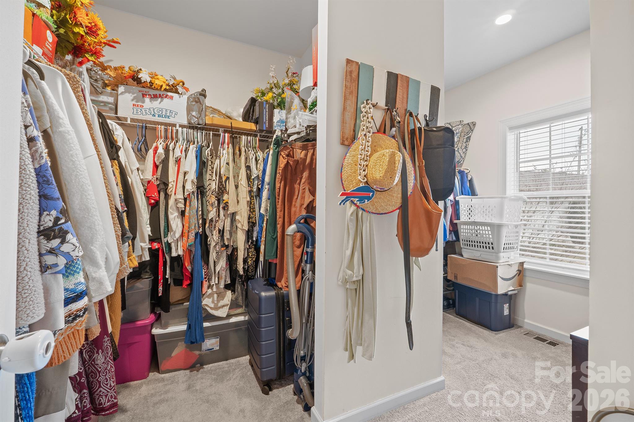 486 Stutts Road Mooresville, NC 28117 - Photo 25 of 35 a view of walk in closet with clothes and shoes