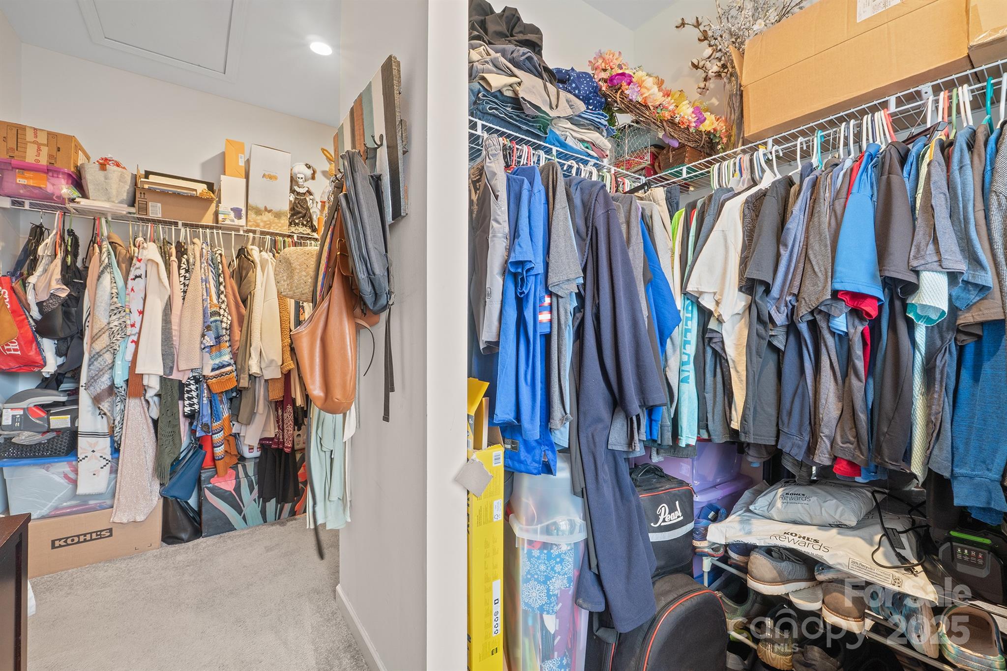 486 Stutts Road Mooresville, NC 28117 - Photo 25 of 35 a view of walk in closet with clothes