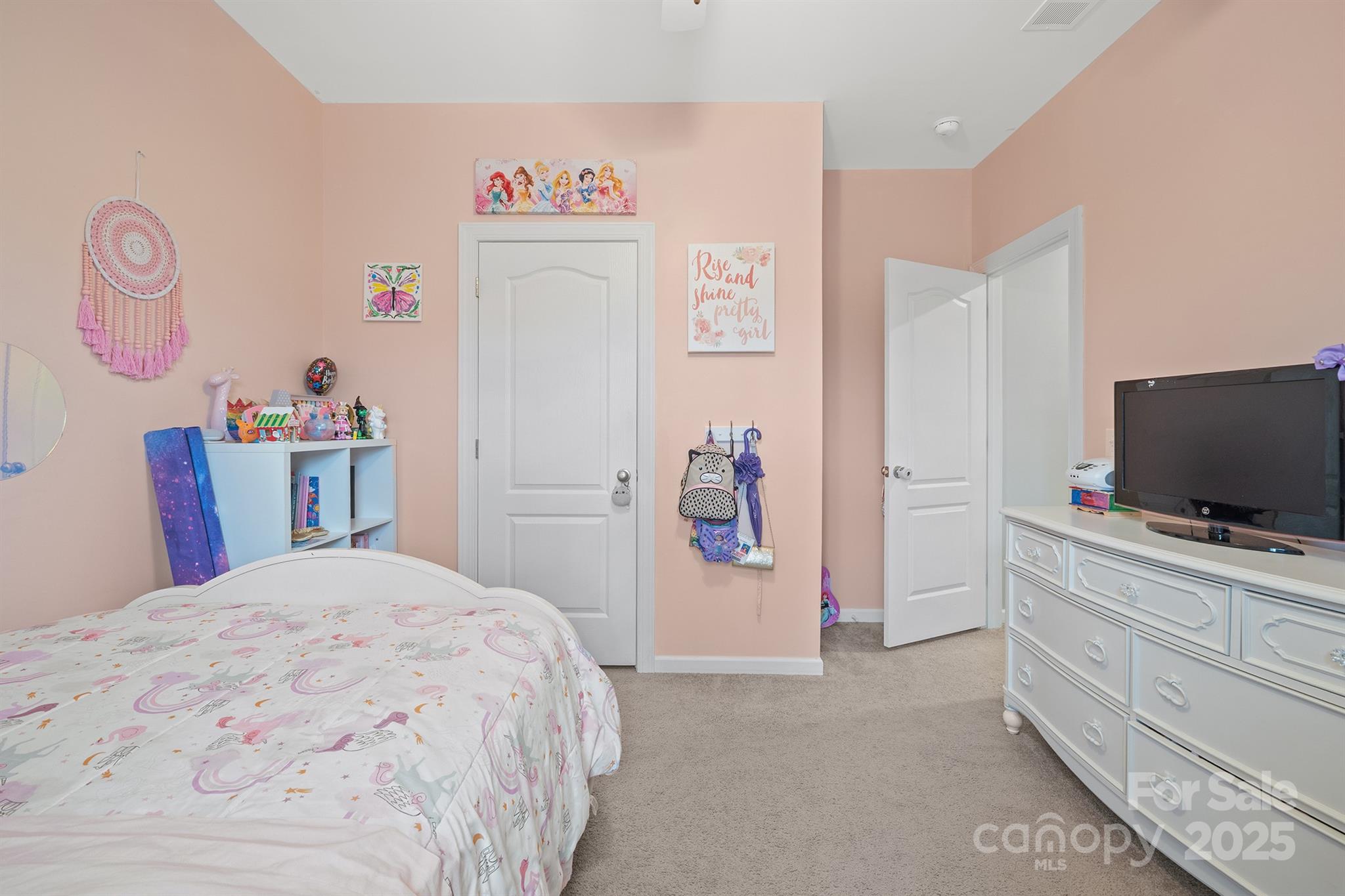 486 Stutts Road Mooresville, NC 28117 - Photo 30 of 35 a bedroom with a bed and a flat screen tv in a dresser